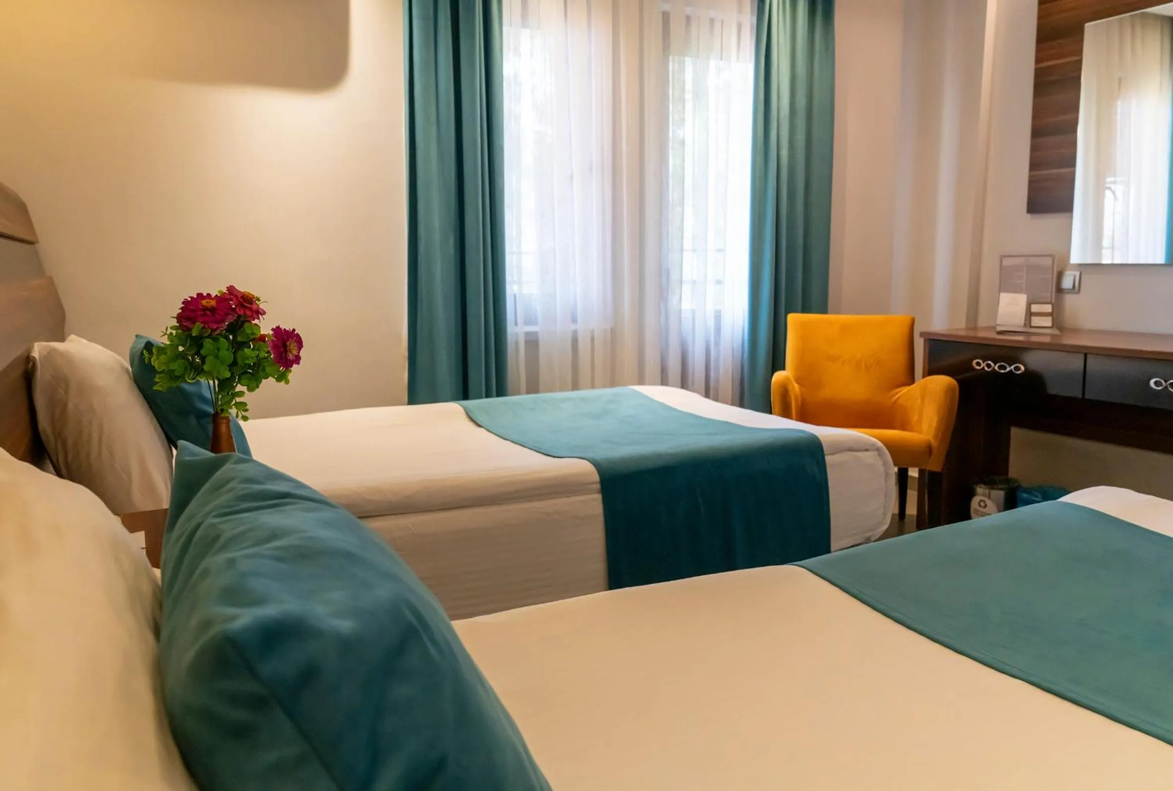 Bed in SIGNATURE GARDEN AVANOS Hotel & SPA