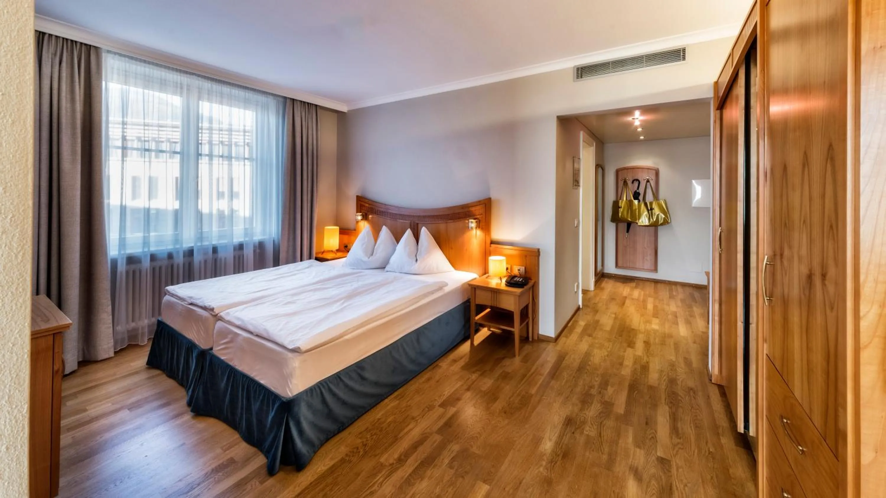 Bed in HOTEL POST alpine cityflair