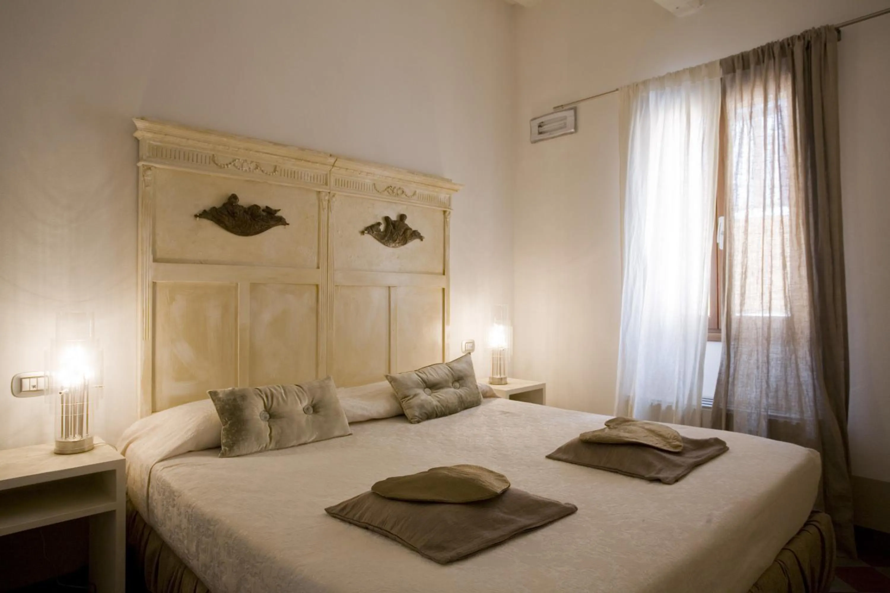 Bed in Art Hotel Al Fagiano