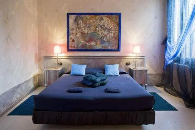 Bed in Art Hotel Al Fagiano