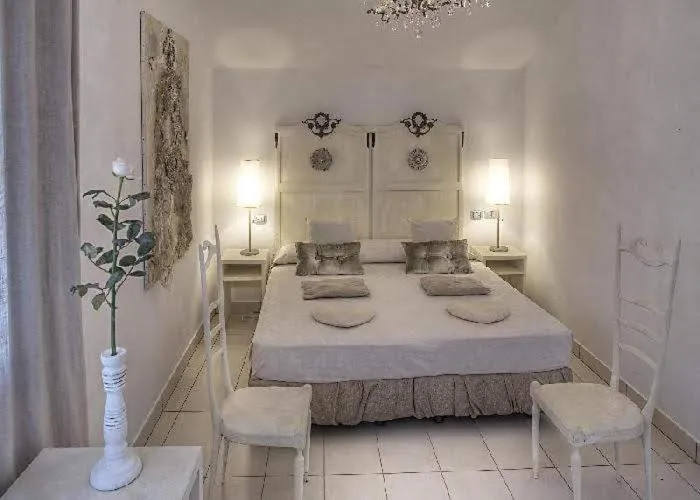 Bed in Art Hotel Al Fagiano