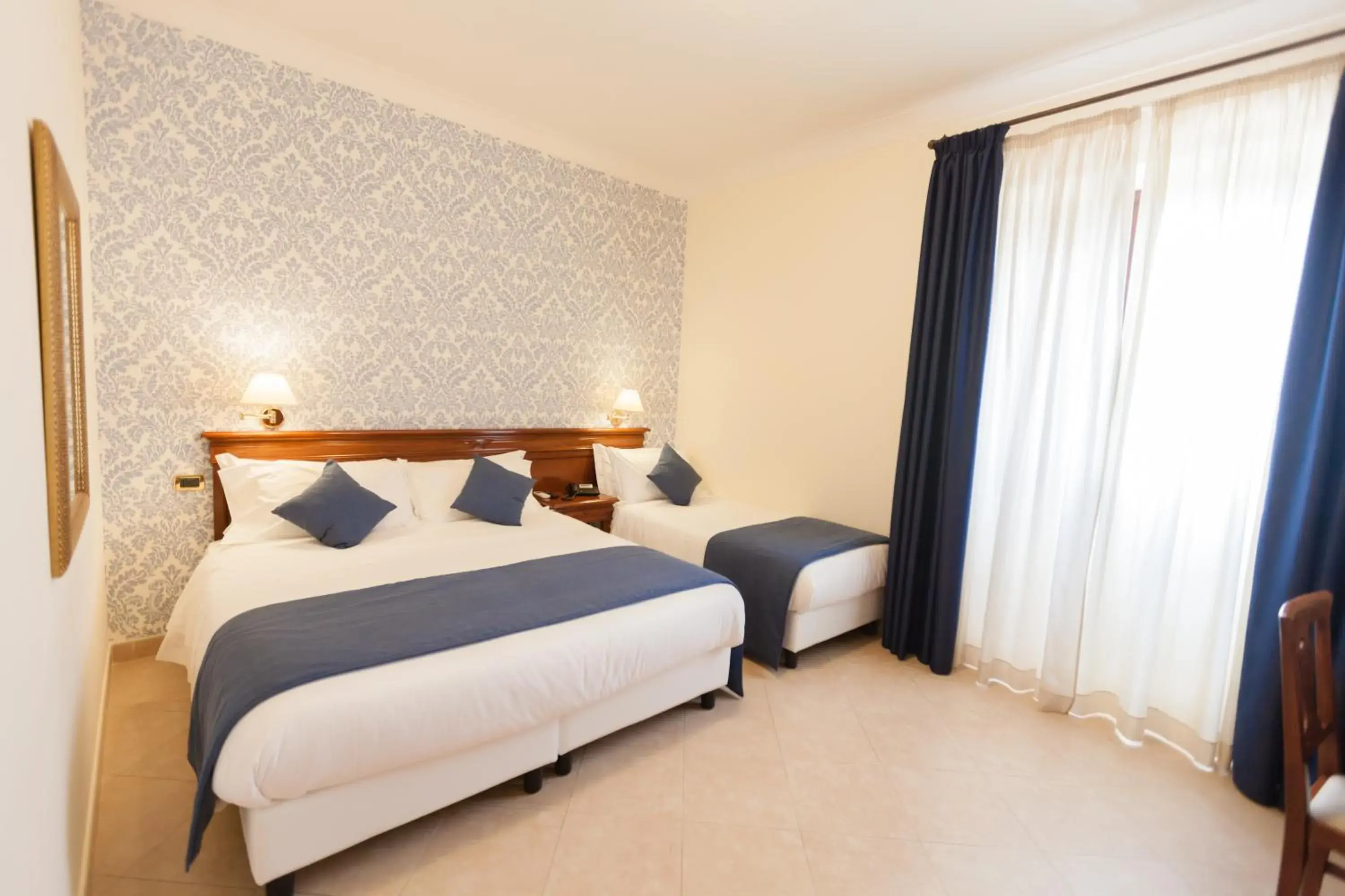 Classic Triple Room in Relais Villa Giuliana Classic Triple Room in Relais Villa Giuliana