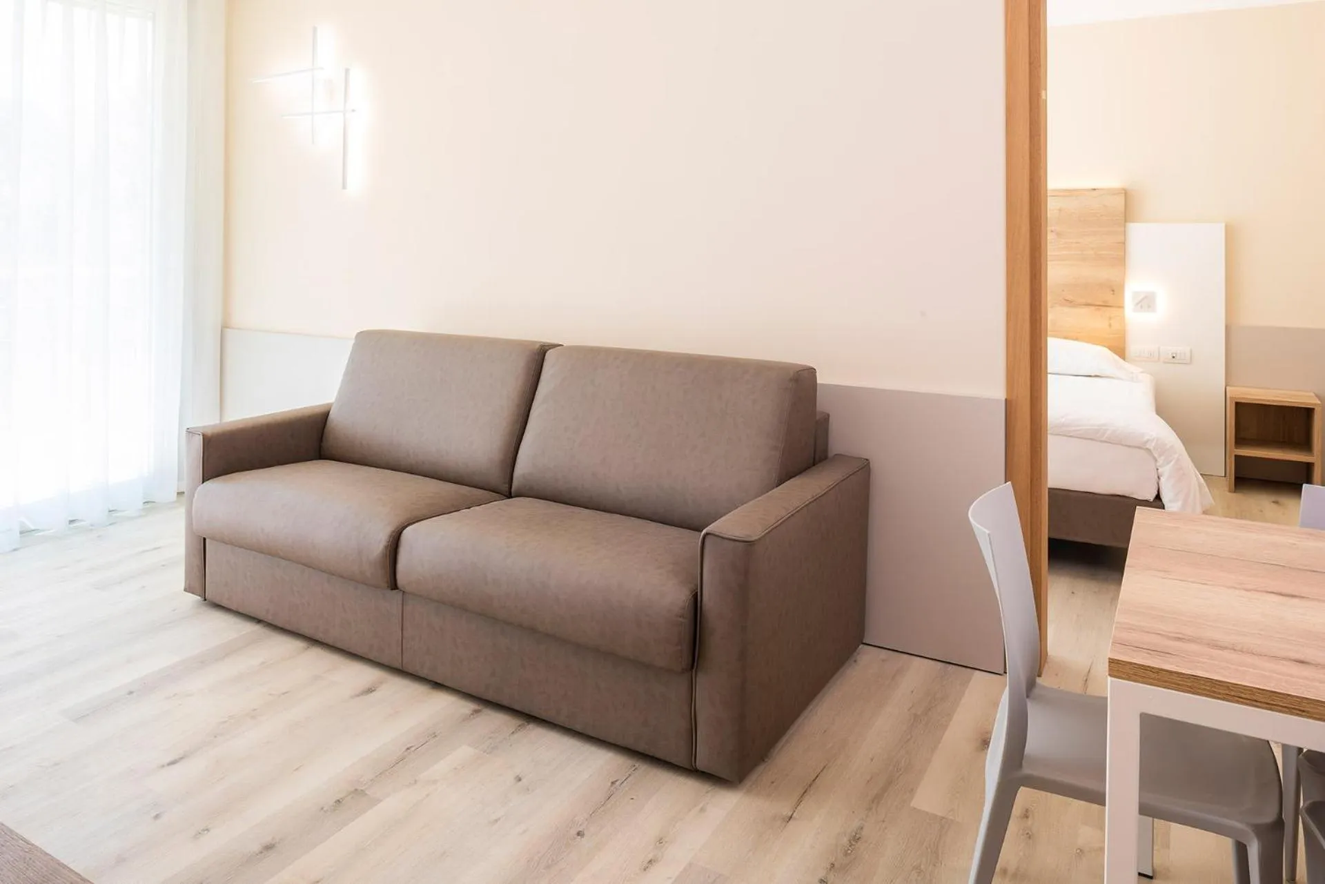 Living room, Bed in Residence Parco Del Garda