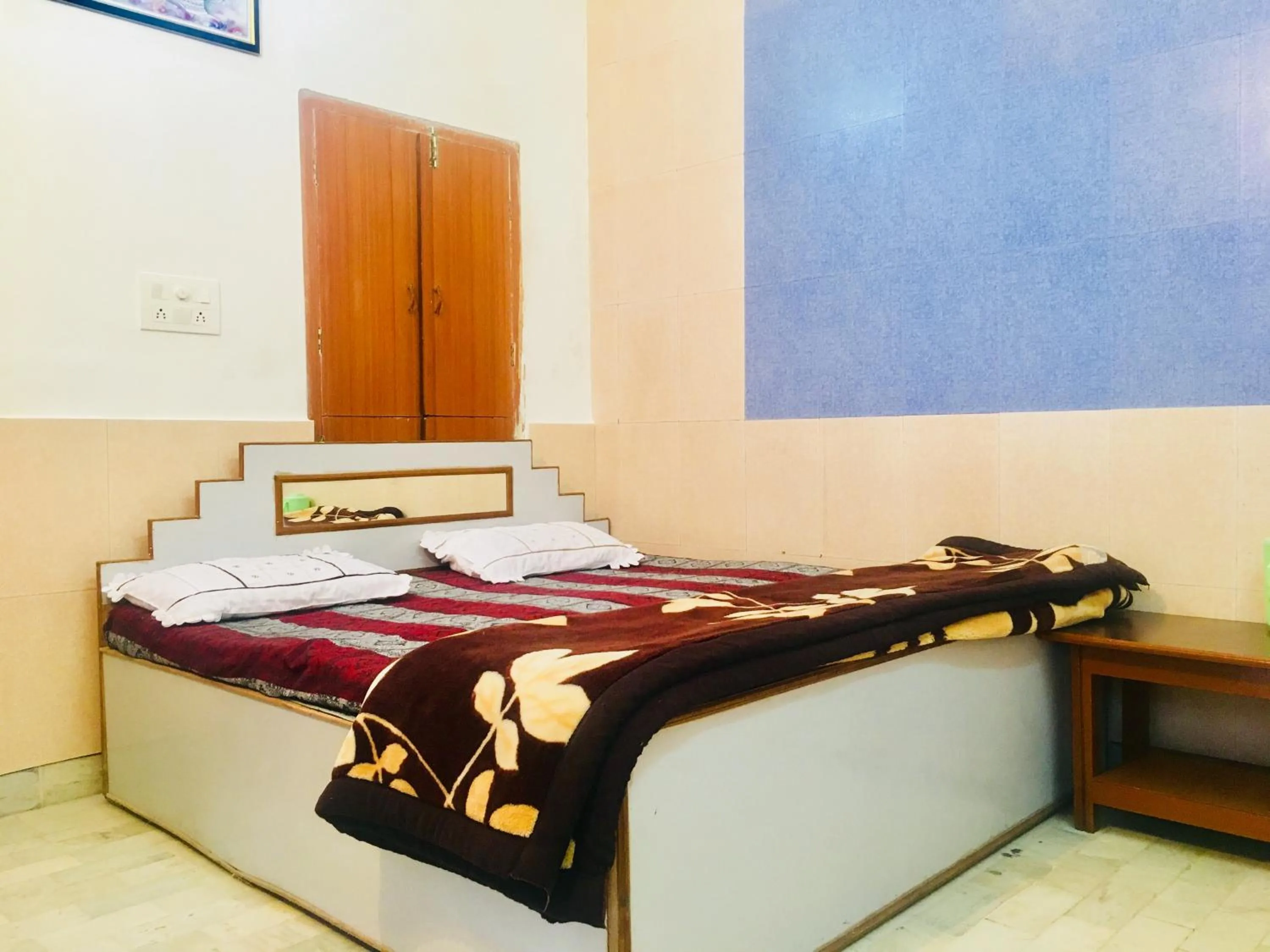 Bed in Hotel Heritage Sanyam