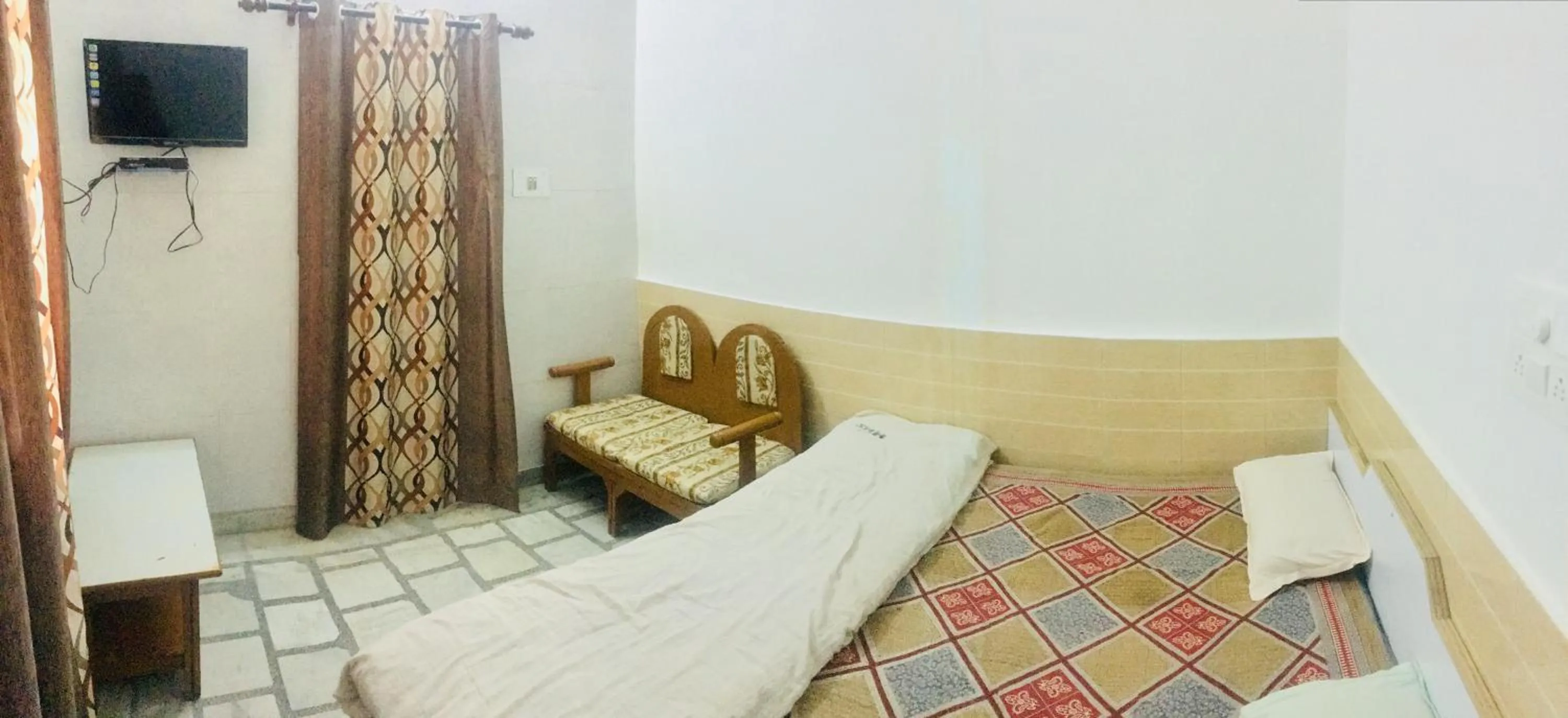 Bed in Hotel Heritage Sanyam