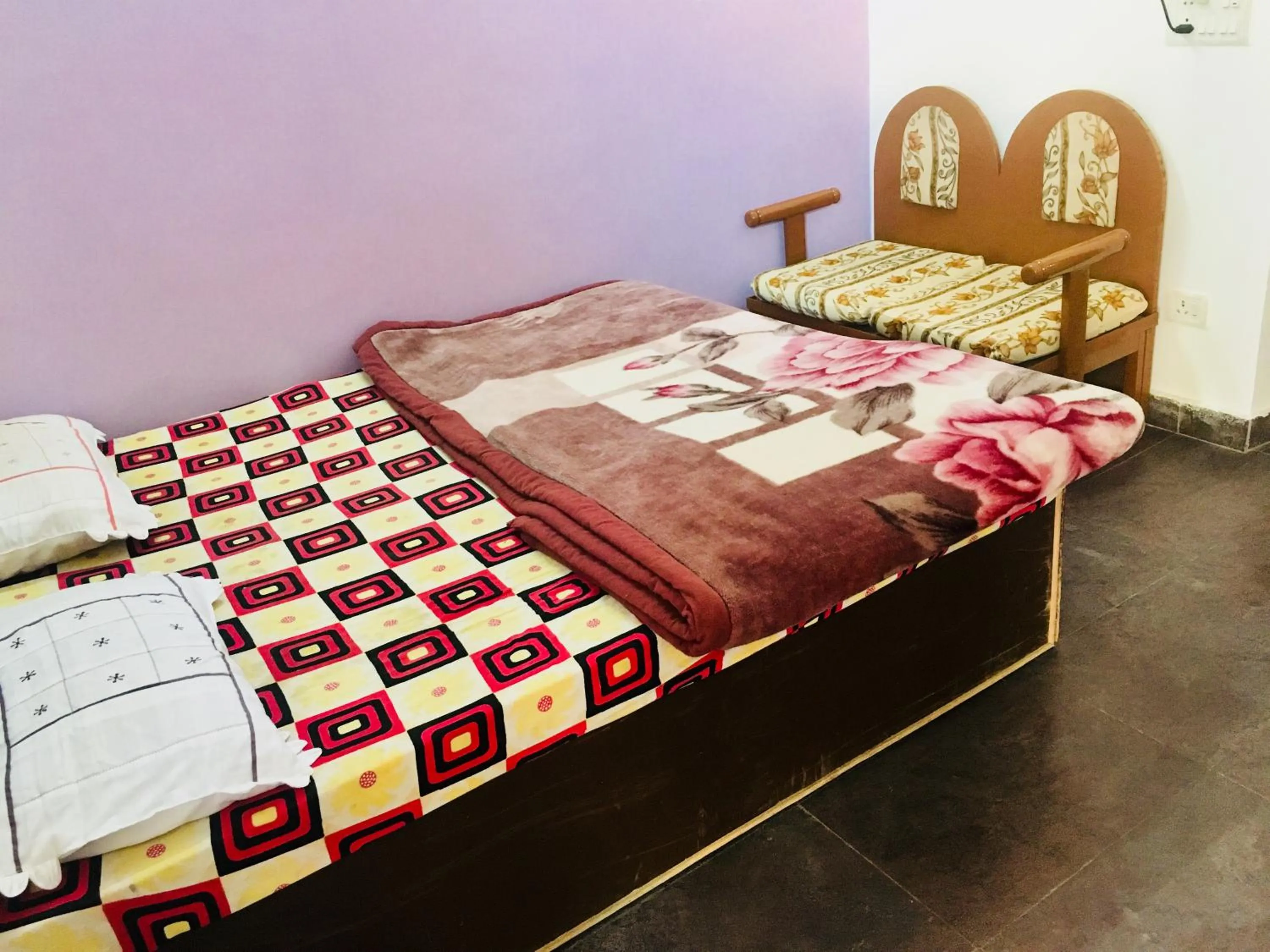 Bed in Hotel Heritage Sanyam