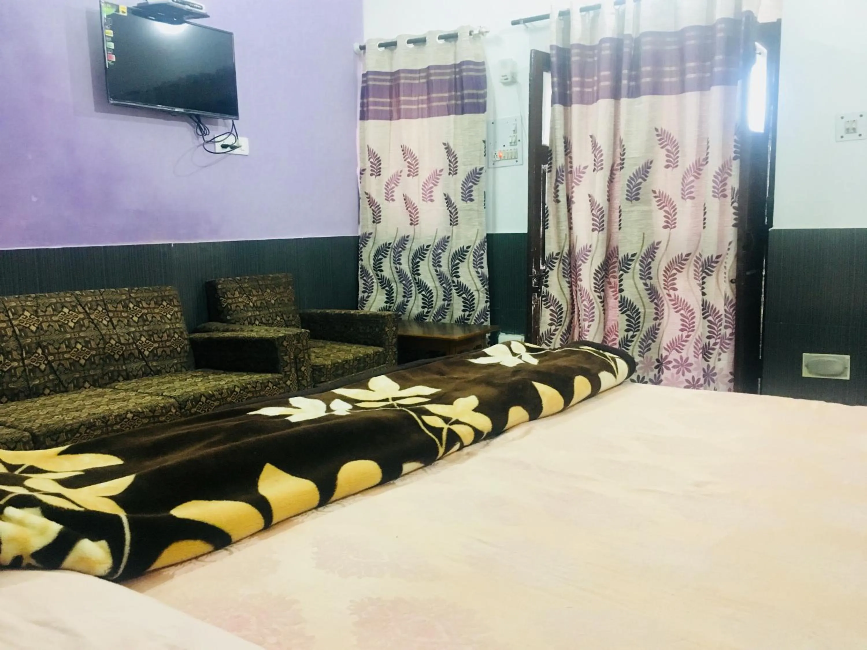 Bed in Hotel Heritage Sanyam