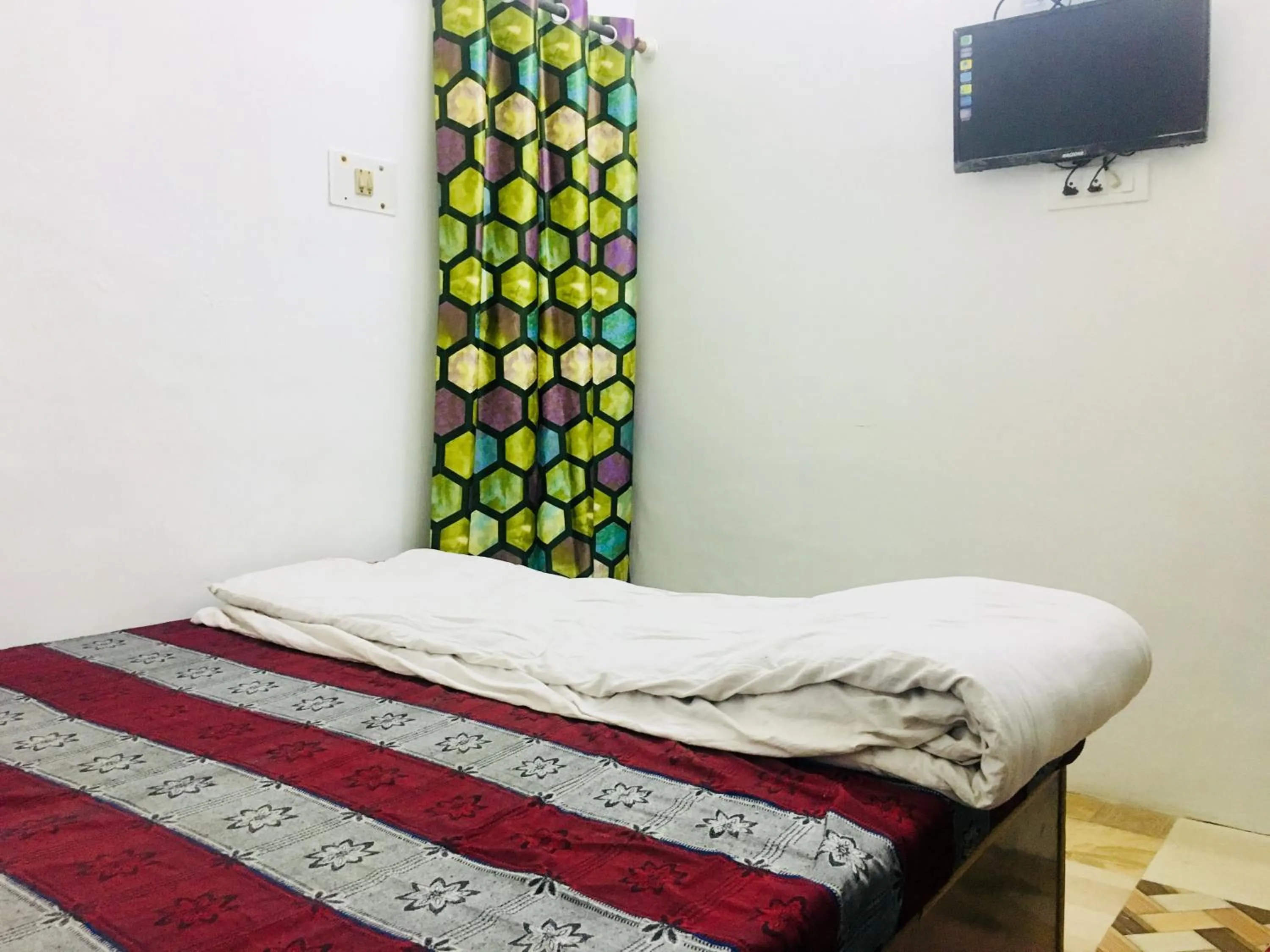 Bed in Hotel Heritage Sanyam