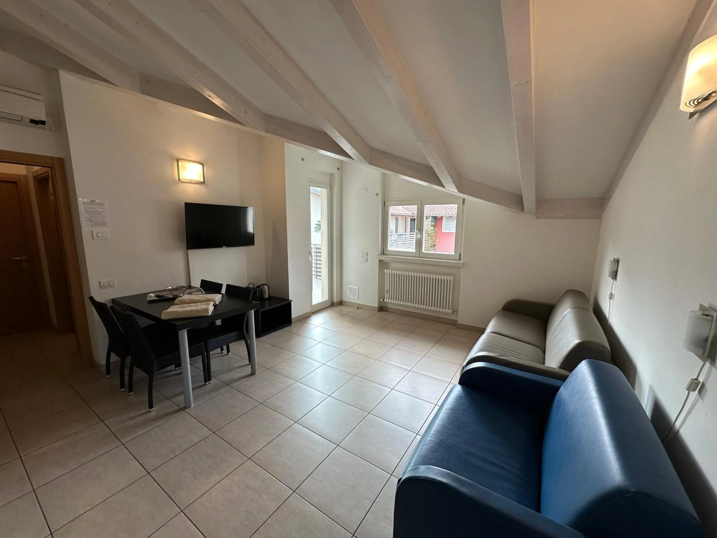 Communal lounge/ TV room in 4 Limoni Apartment Resort