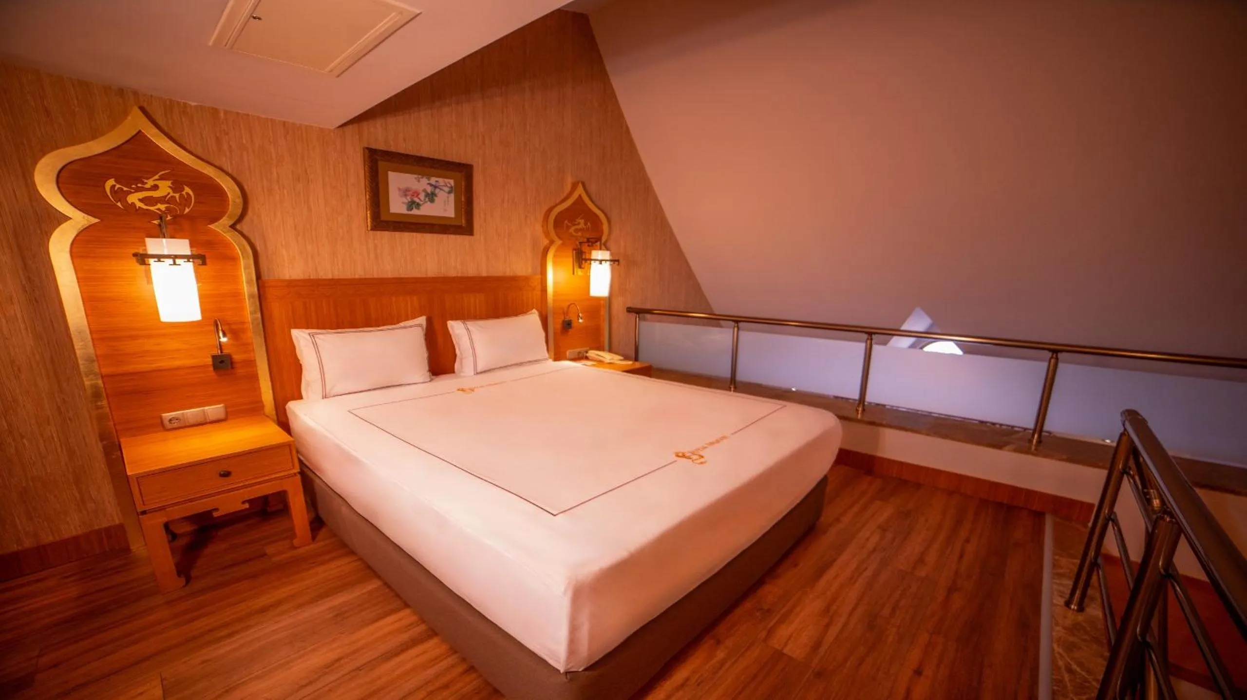 Bed in Royal Dragon Hotel