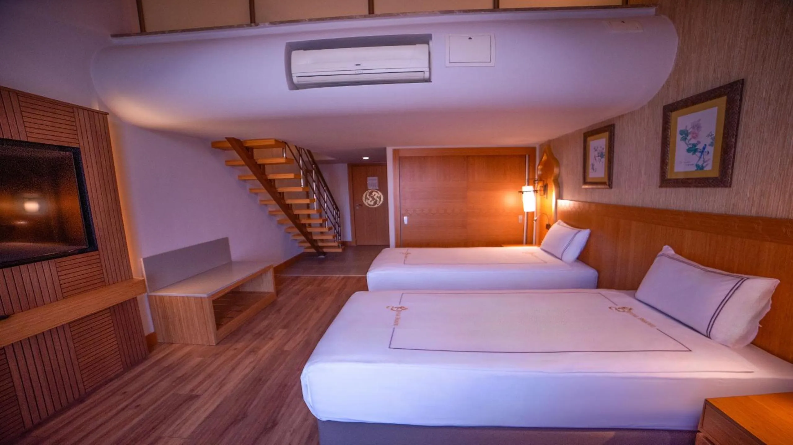 Bed in Royal Dragon Hotel