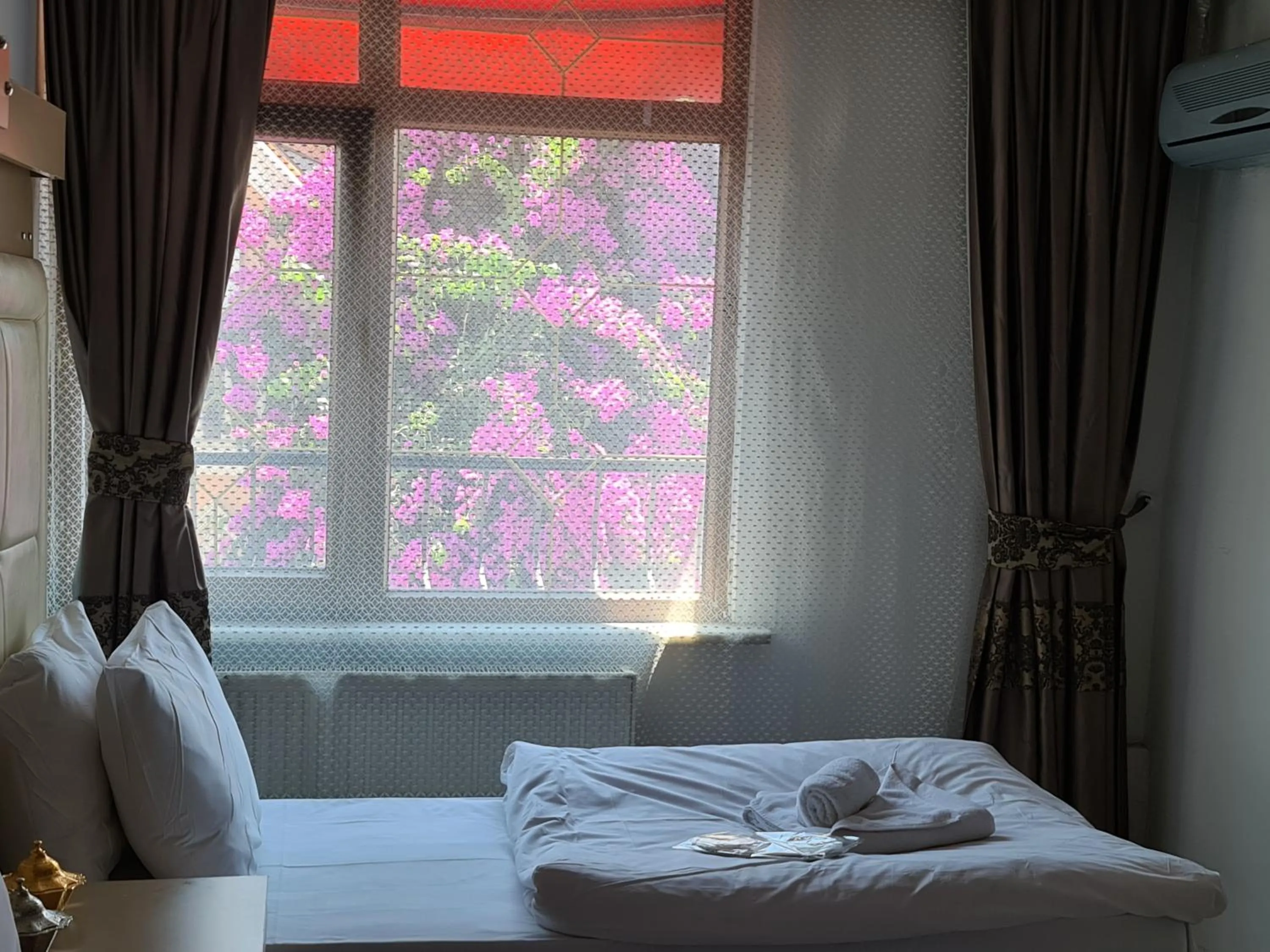 Bed in Oceans 7 Hotel