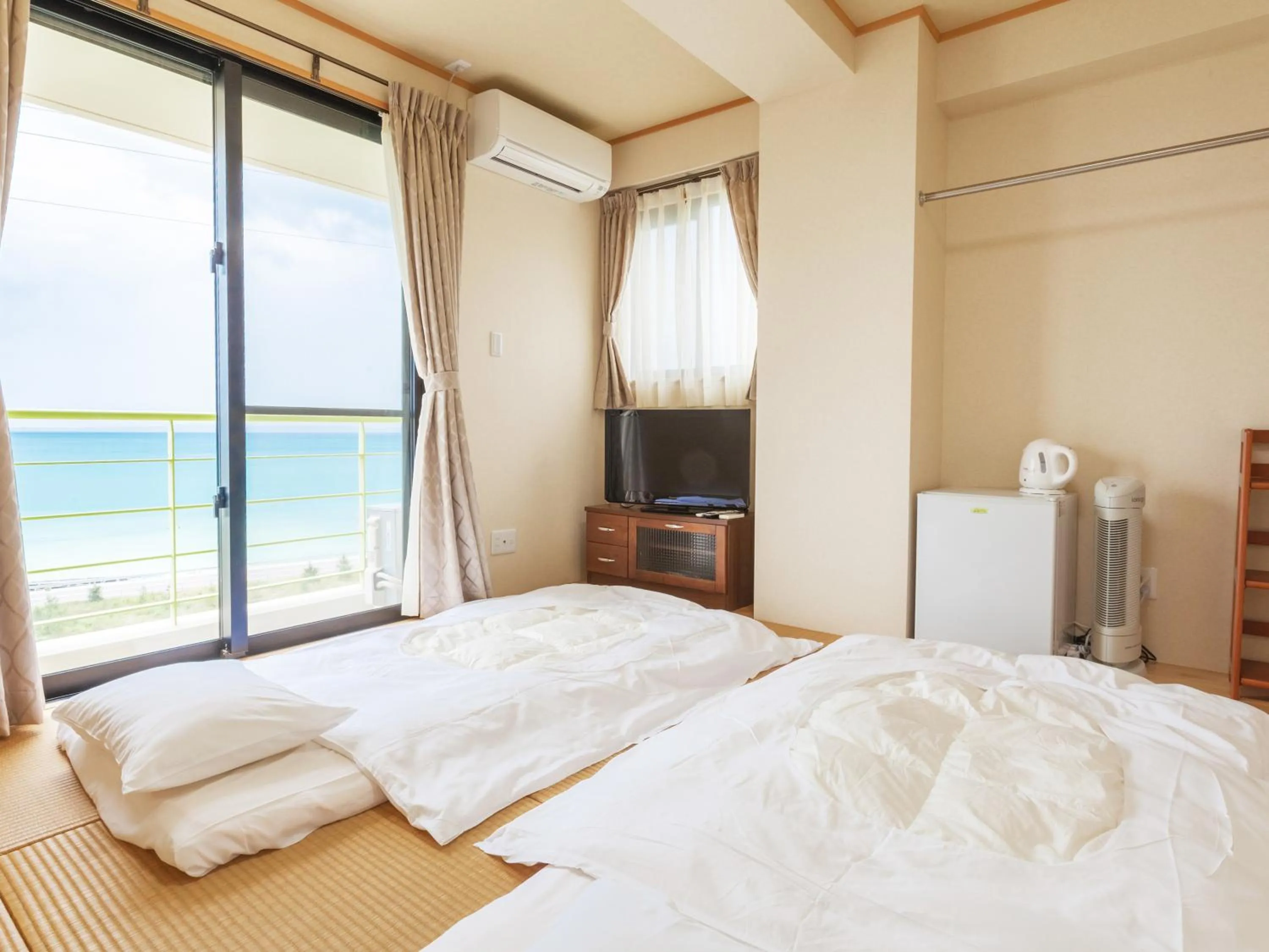 Bedroom in Kariyushi Condominium Ocean Hills Chouraku Stay