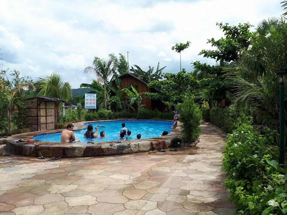 Swimming pool in Calayo Beach Resort