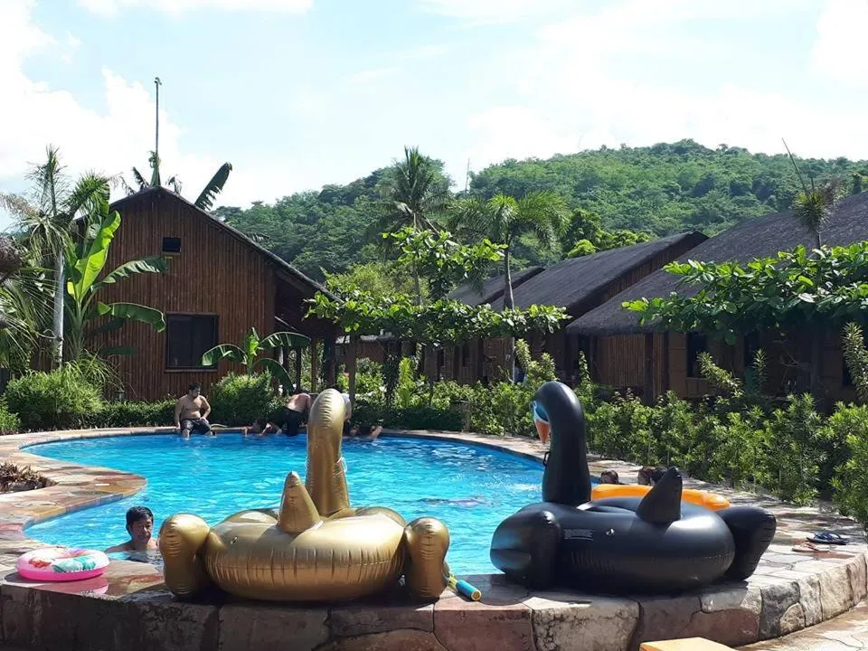 Swimming pool in Calayo Beach Resort
