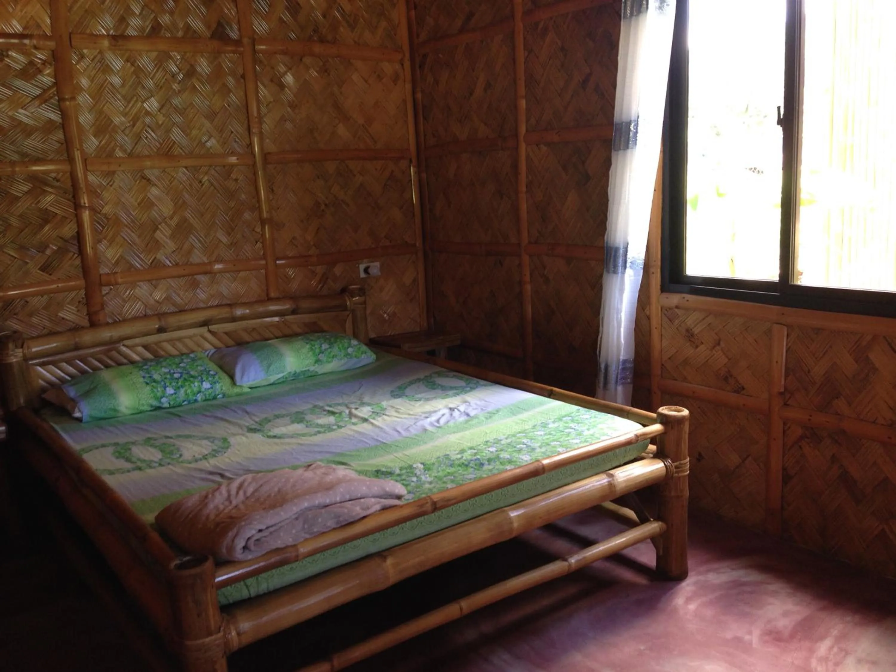 Bed in Calayo Beach Resort