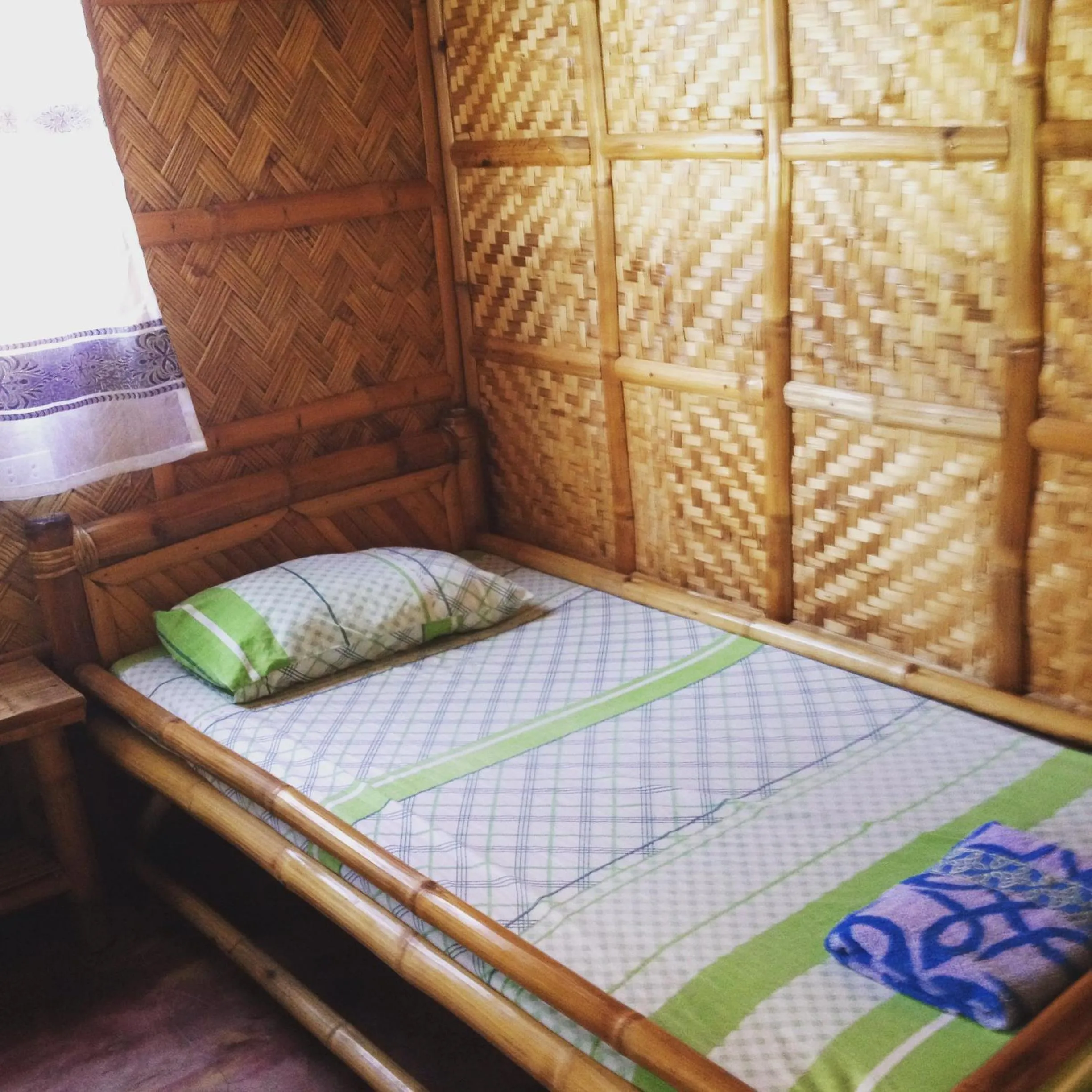 Bed in Calayo Beach Resort