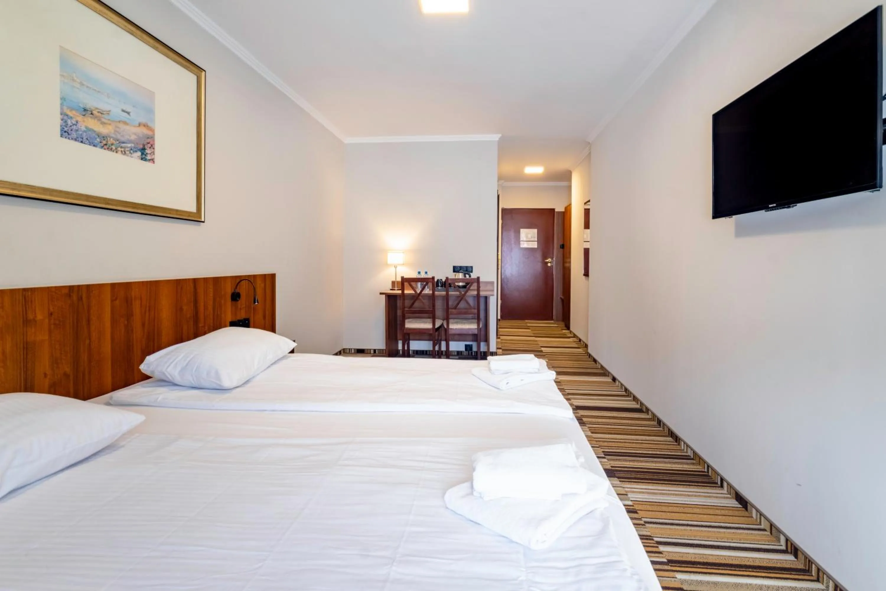 Communal lounge/ TV room, Bed in Hit Hotel