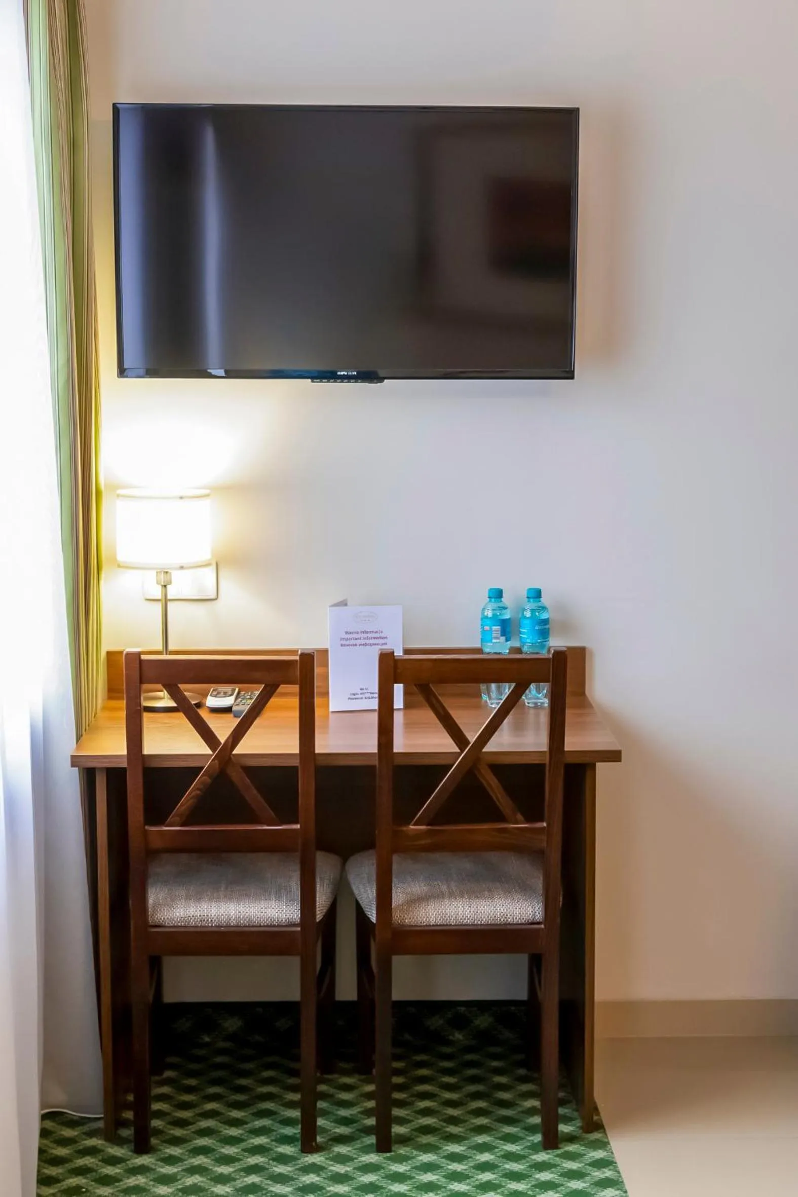 Communal lounge/ TV room in Hit Hotel