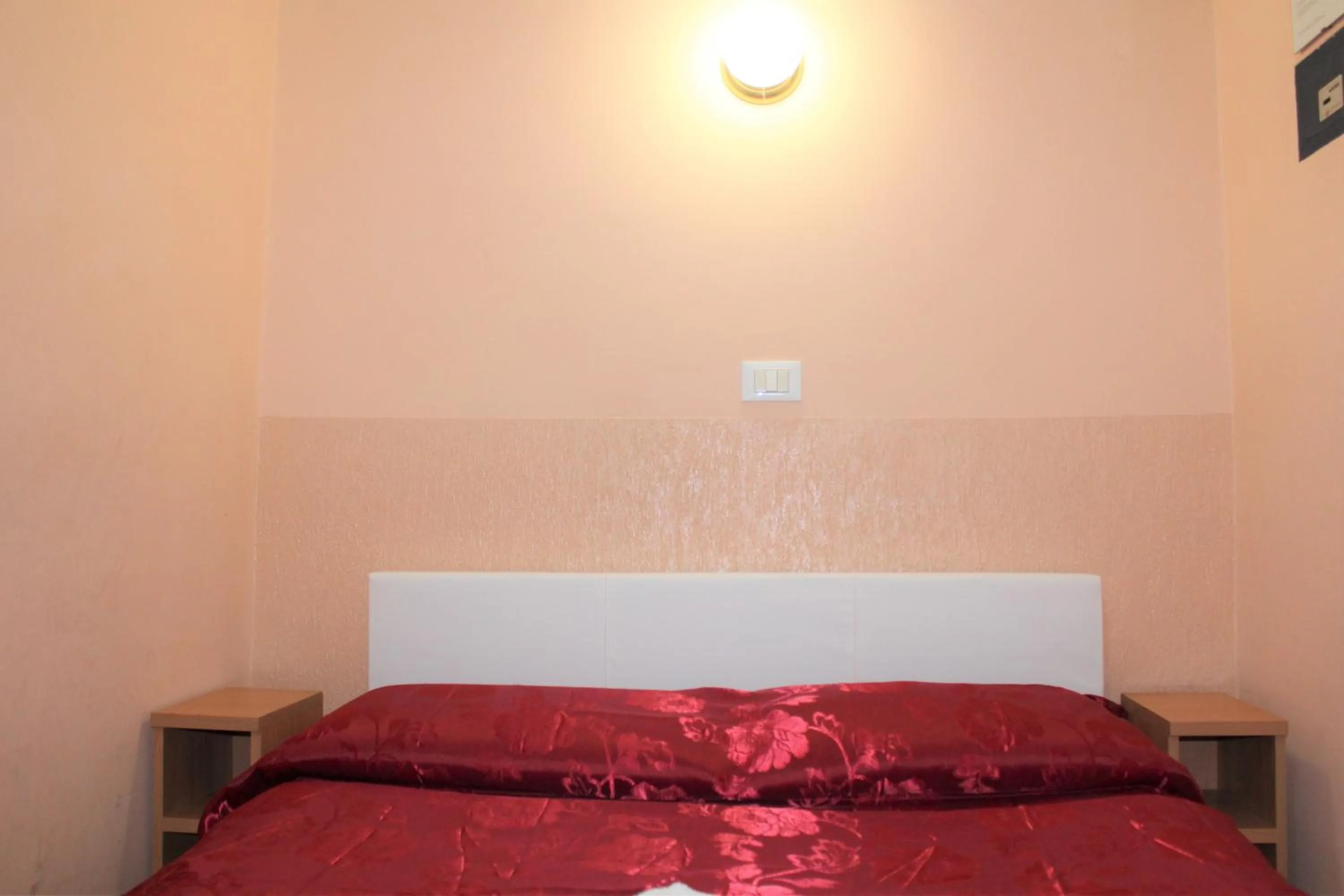 Bed in Hotel Eurorooms