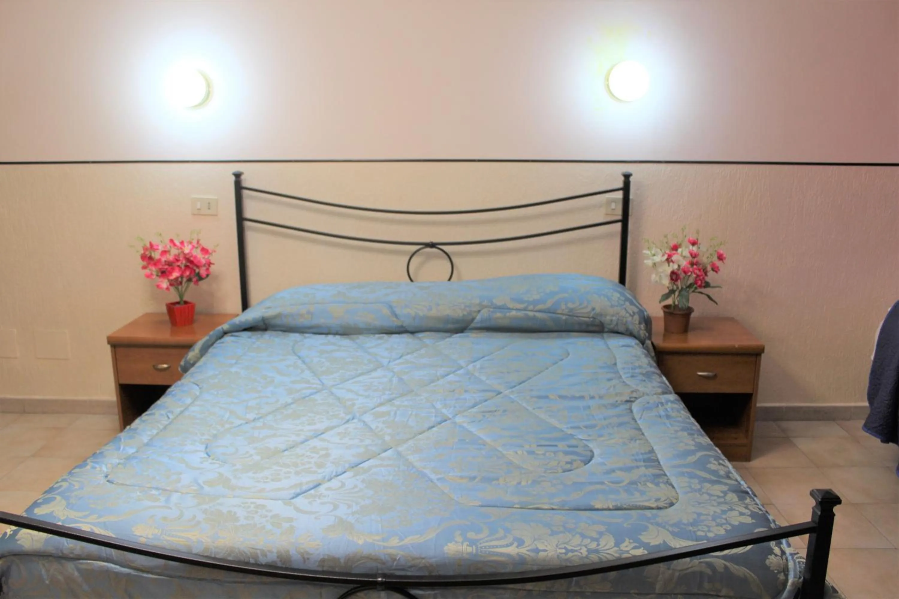 Bed in Hotel Eurorooms