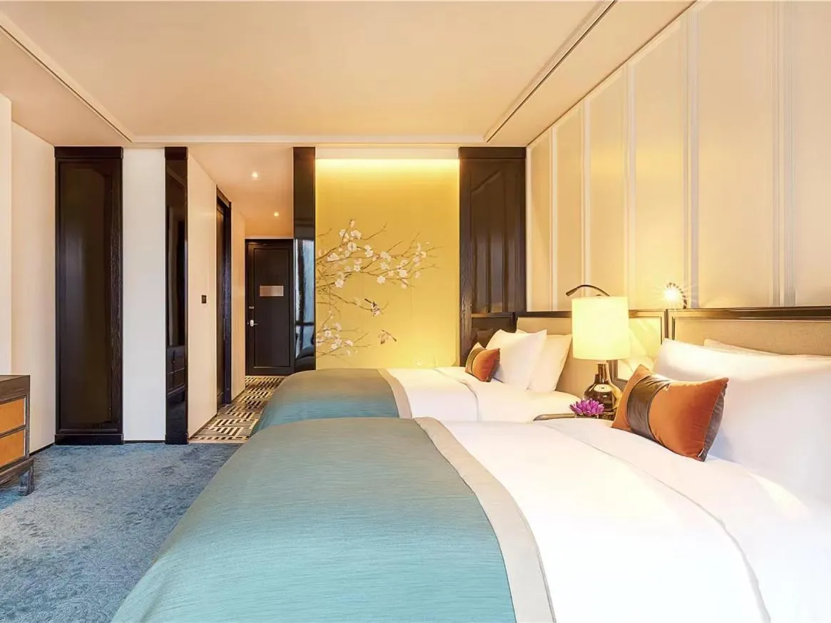 Bed in JiuTai Hotel Hangzhou