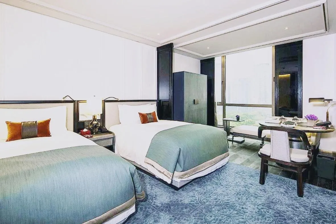 Bed in JiuTai Hotel Hangzhou