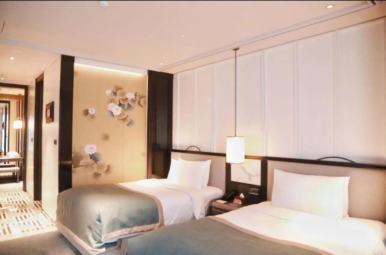 Bed in JiuTai Hotel Hangzhou