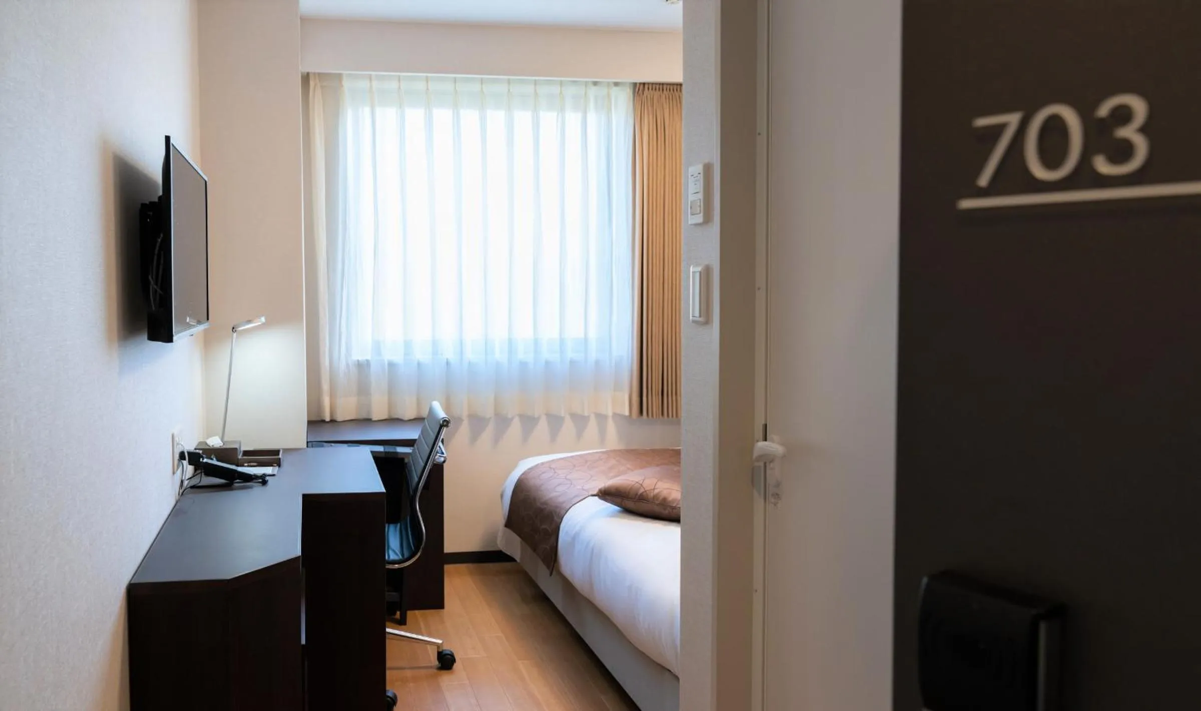 Photo of the whole room, Bed in Hotel Katsuyama Premiere