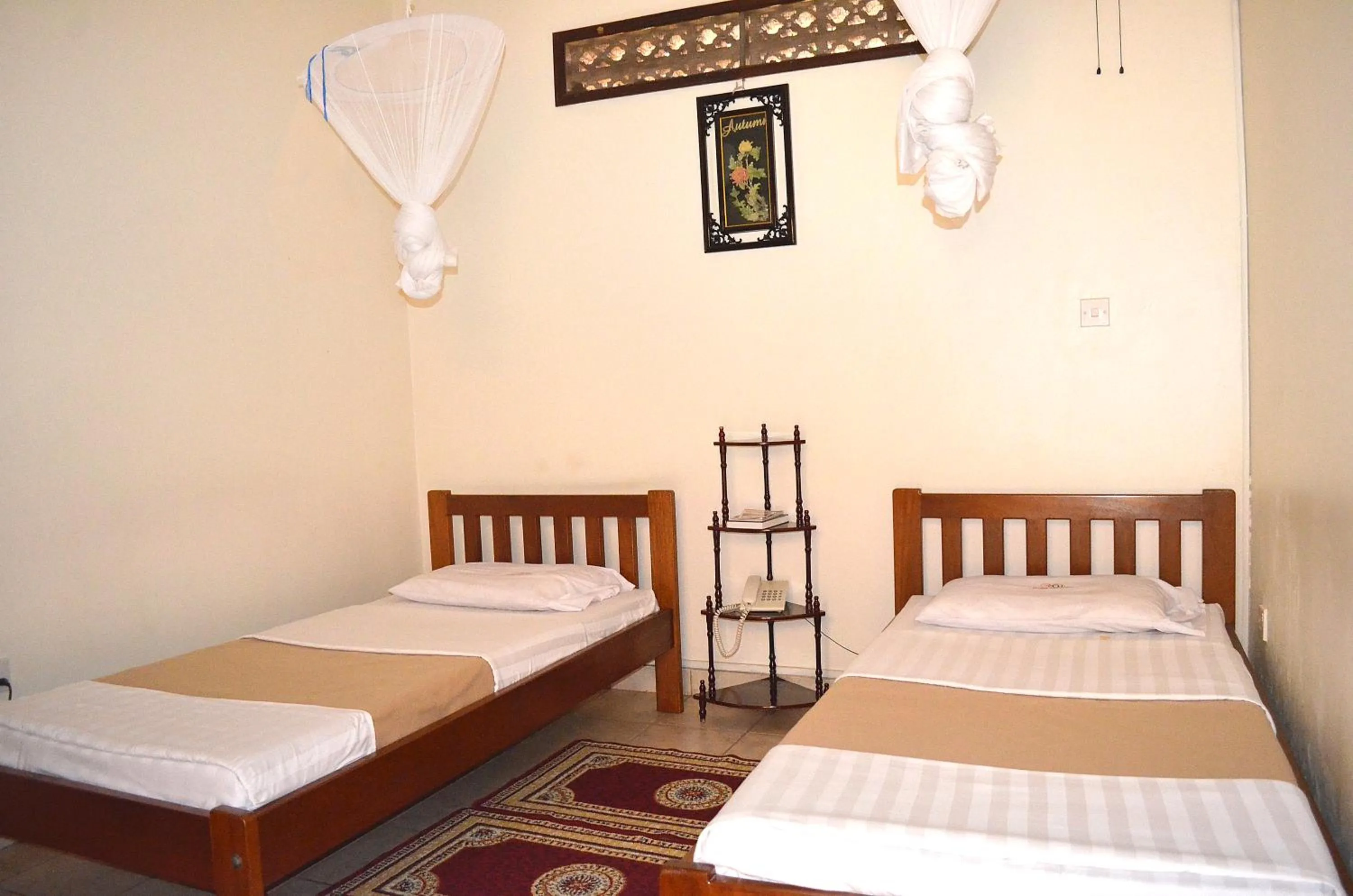 Bedroom in Victoria Travel Hotel