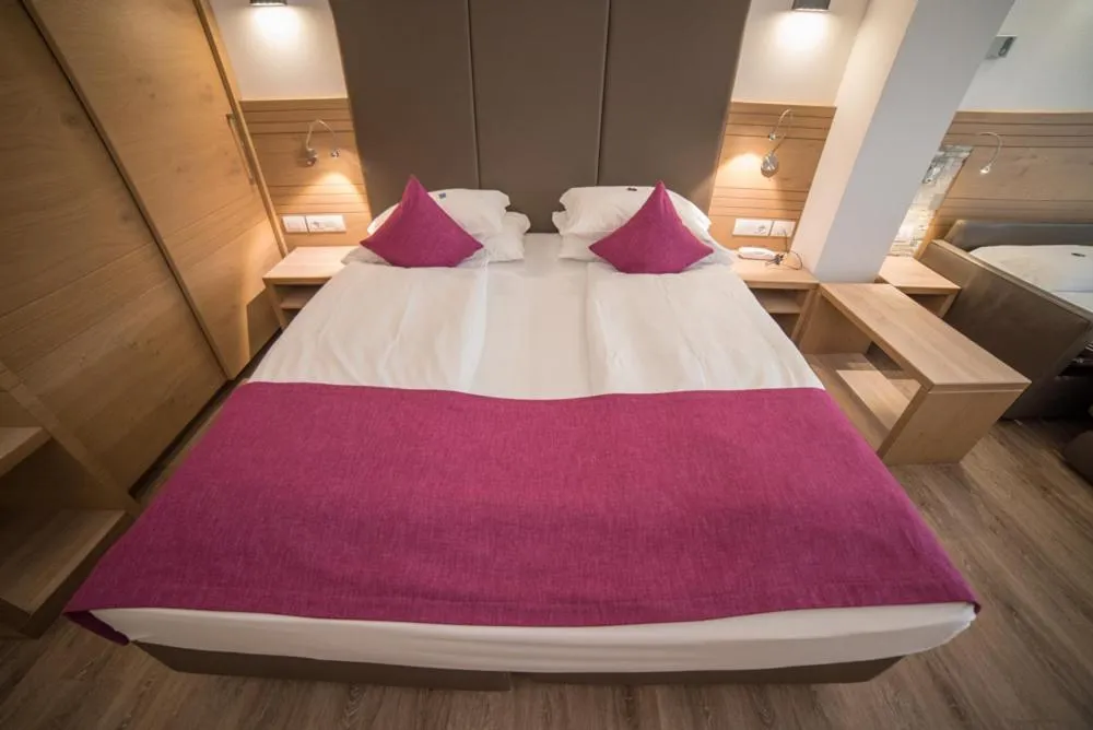 Bed in Olimpionico Hotel