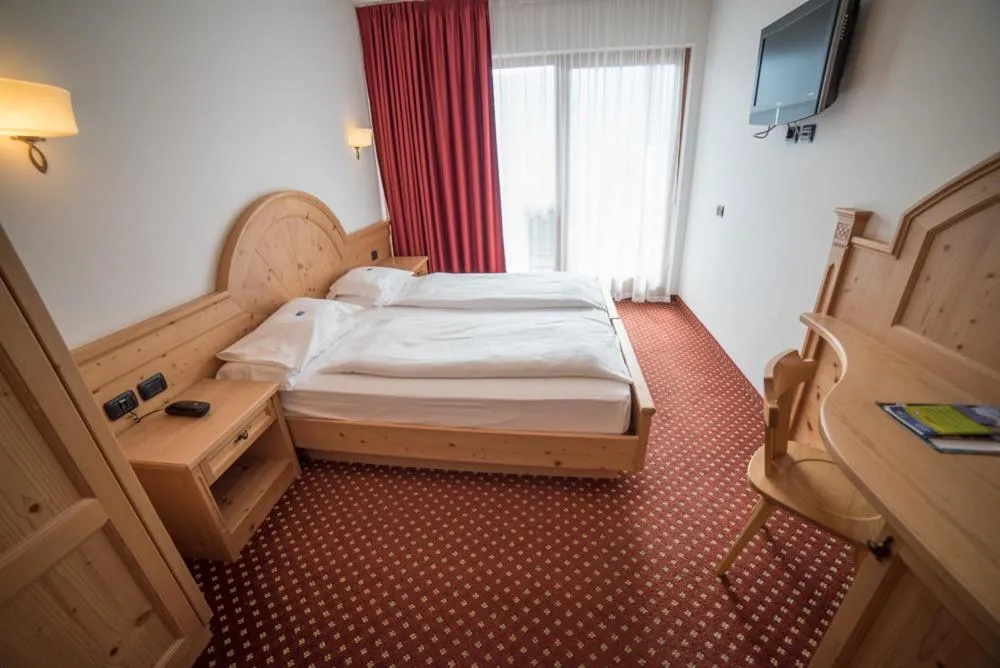 Bed in Olimpionico Hotel