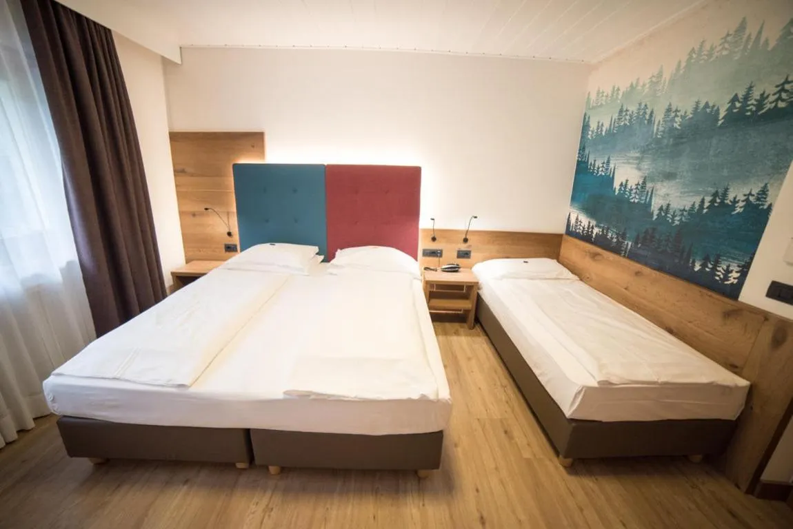 Bed in Olimpionico Hotel