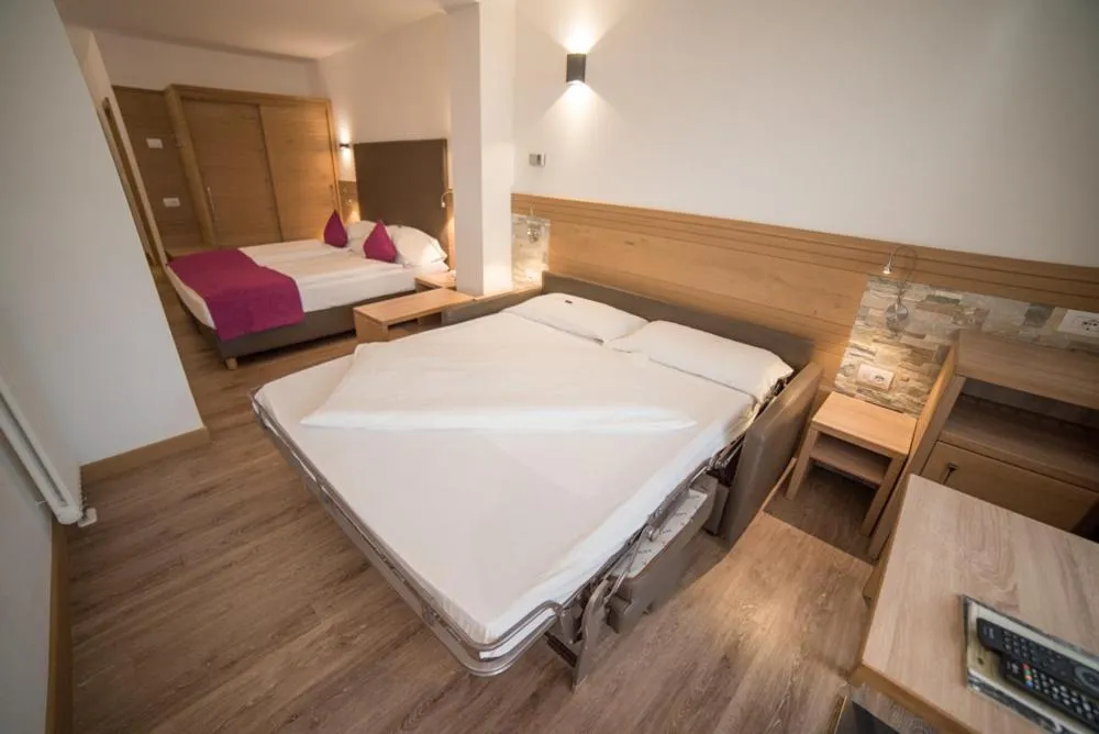 Bed in Olimpionico Hotel