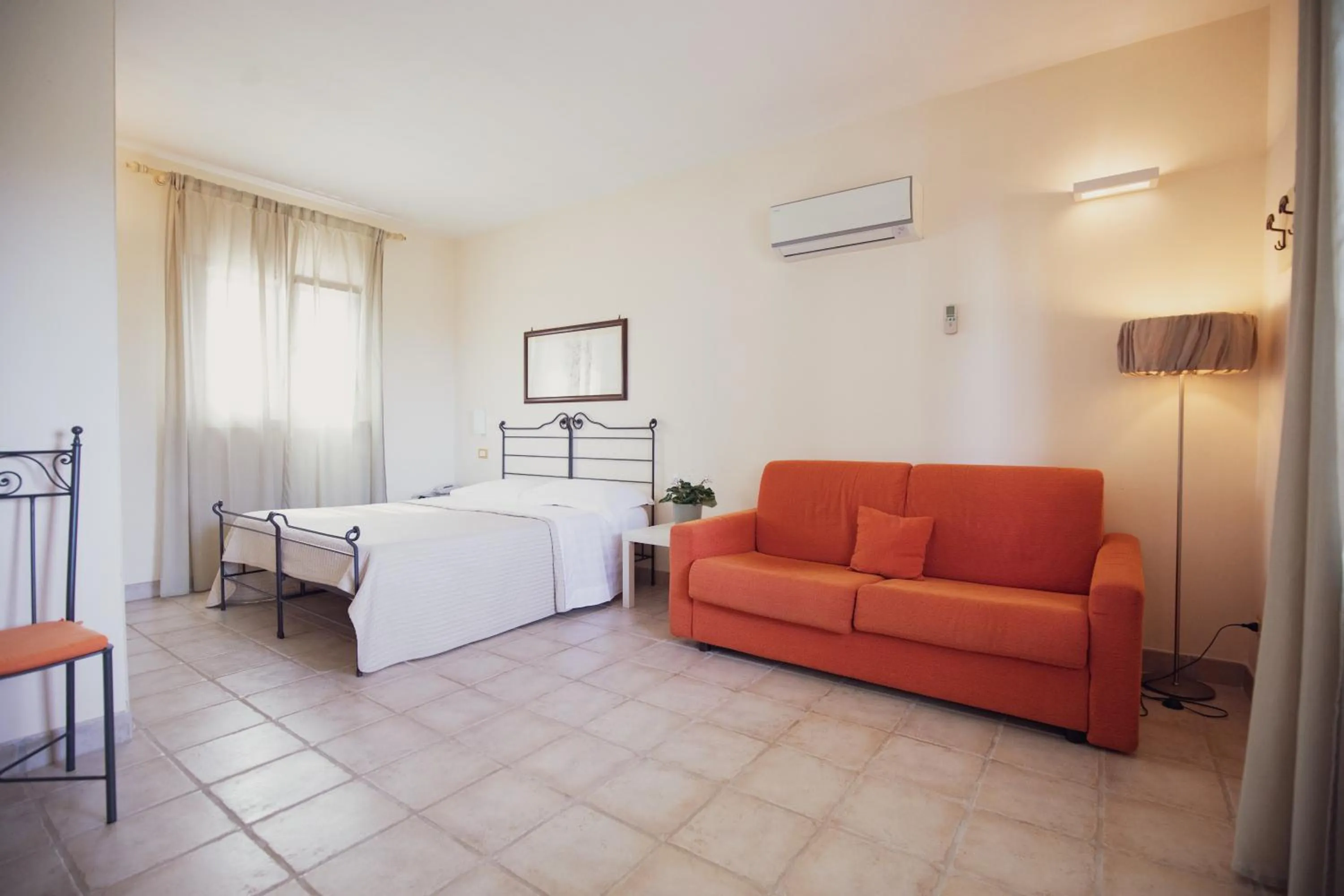 Living room, Bed in Corte Di Ferro Hotel & Wellness Resort