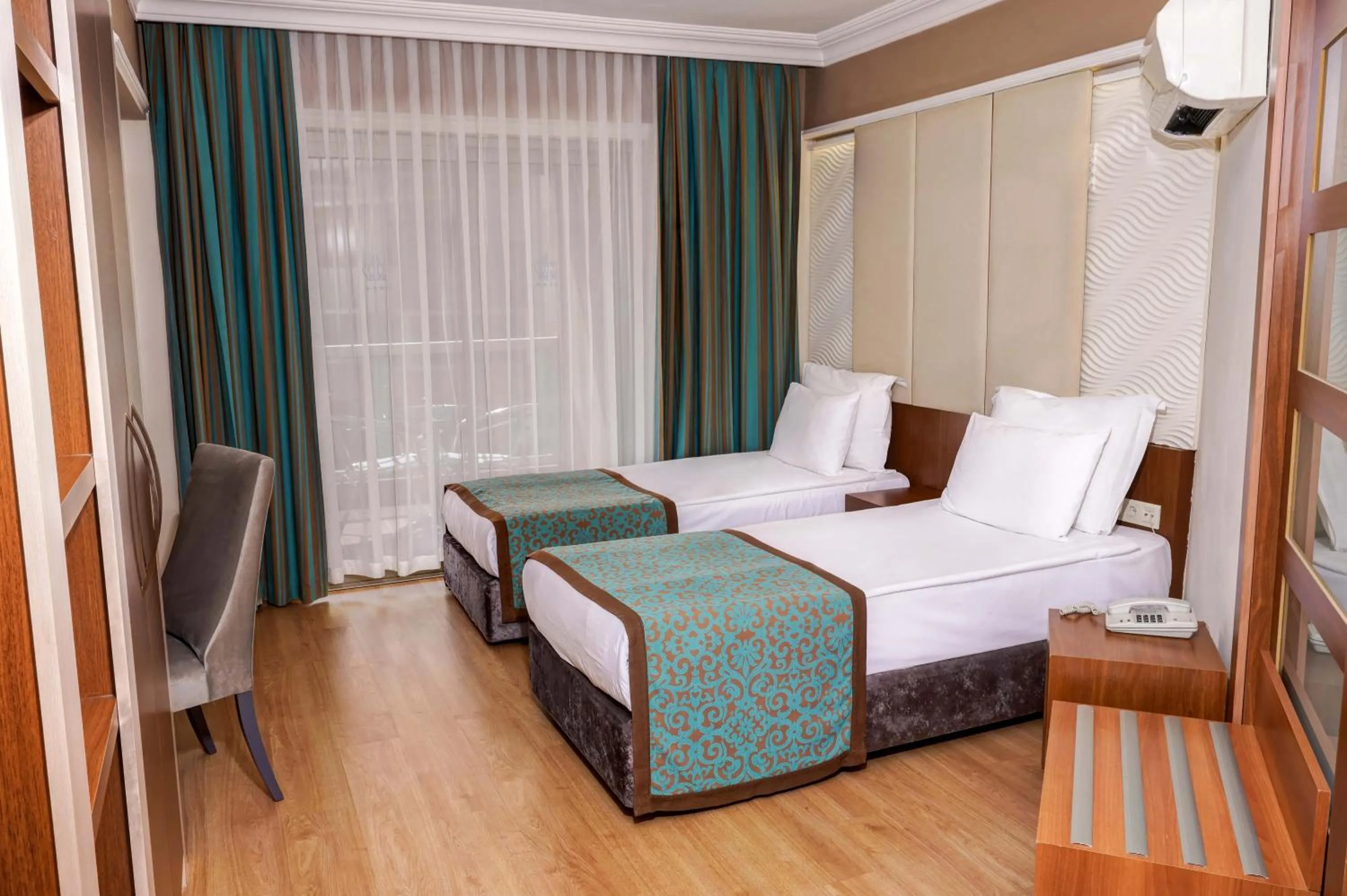 Bed in Tac Premier Hotel & Spa