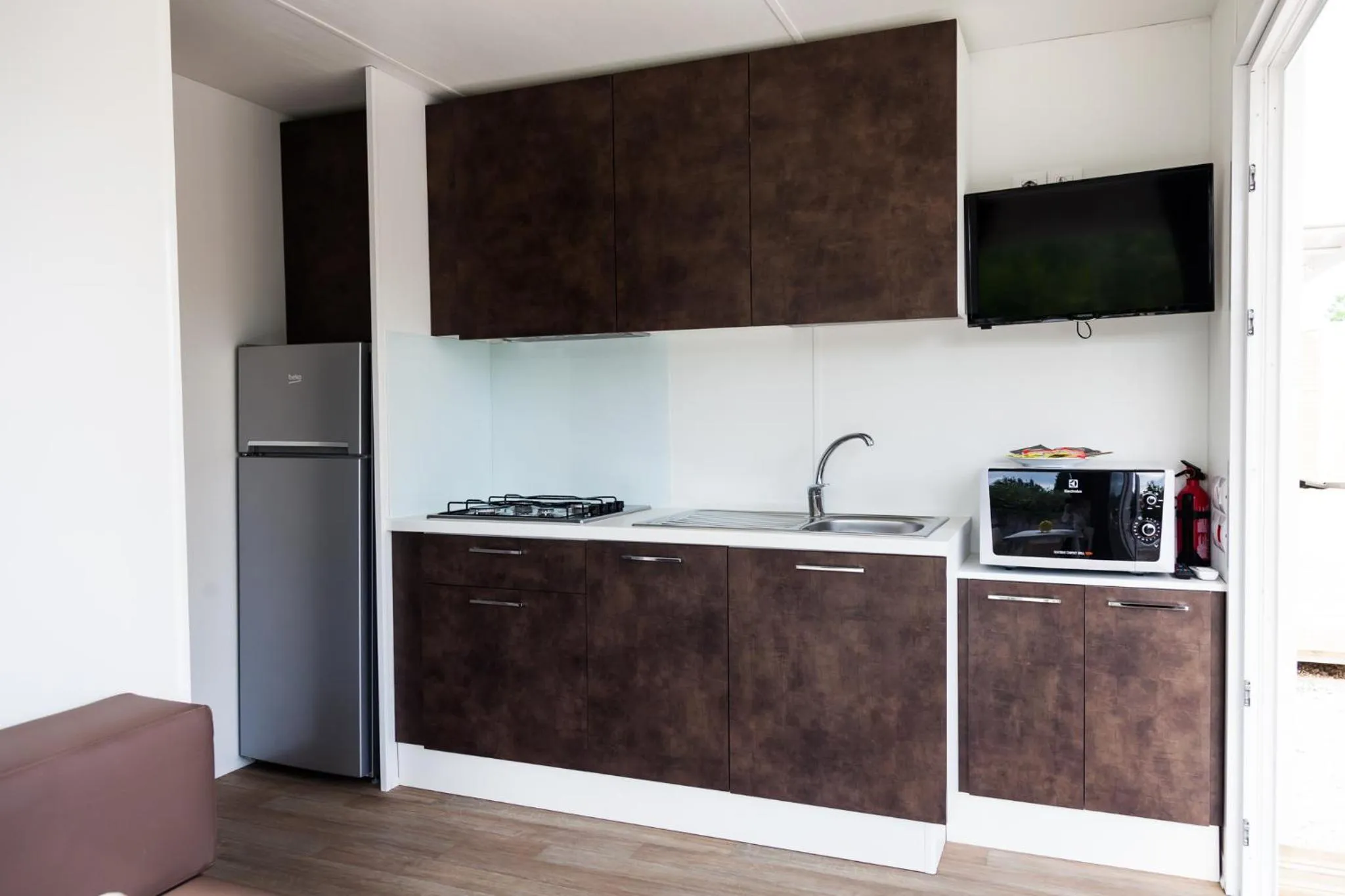 Kitchen or kitchenette in Club del Sole Desenzano Boutique Resort