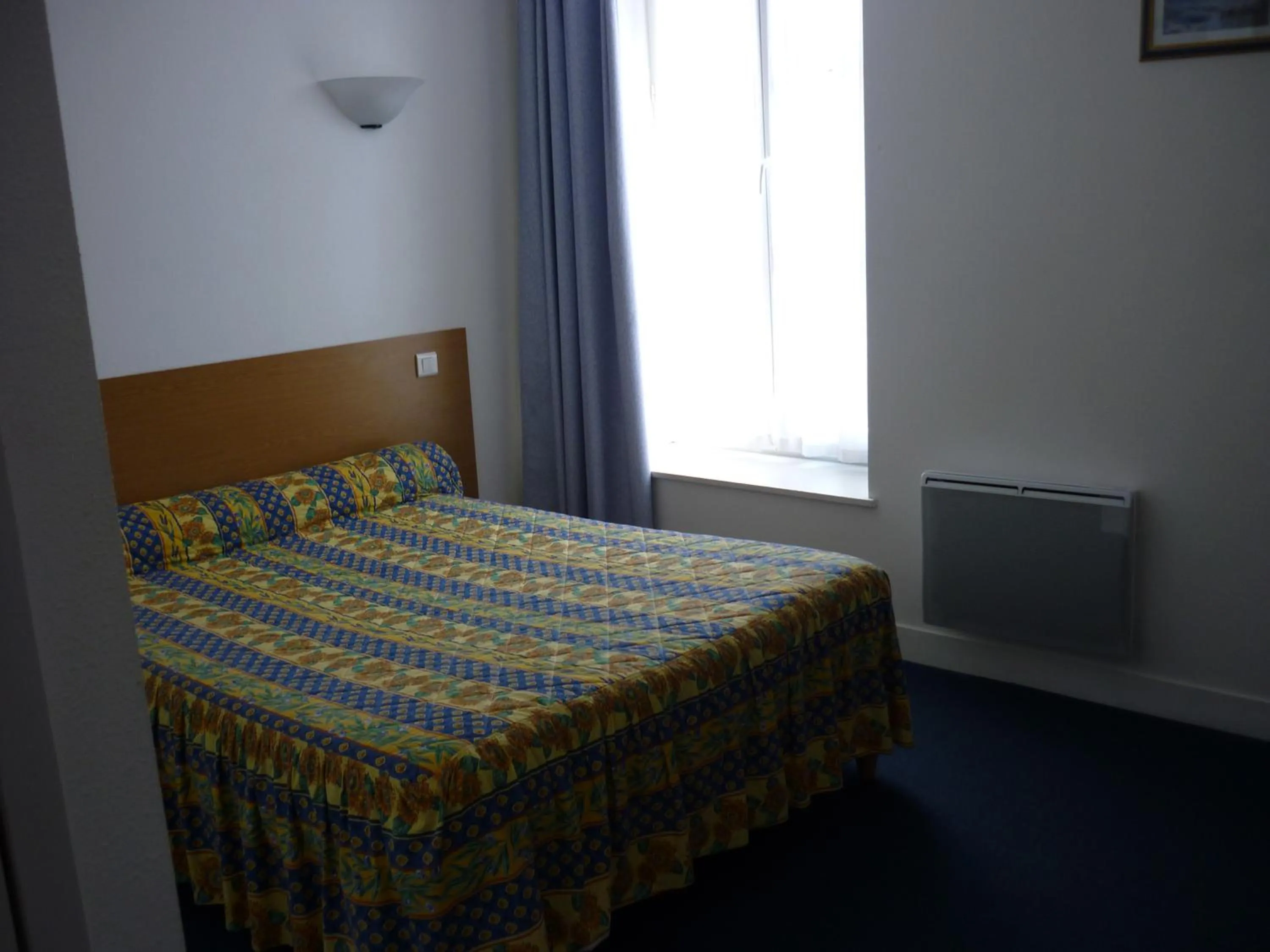 Bed in Hotel Neptune