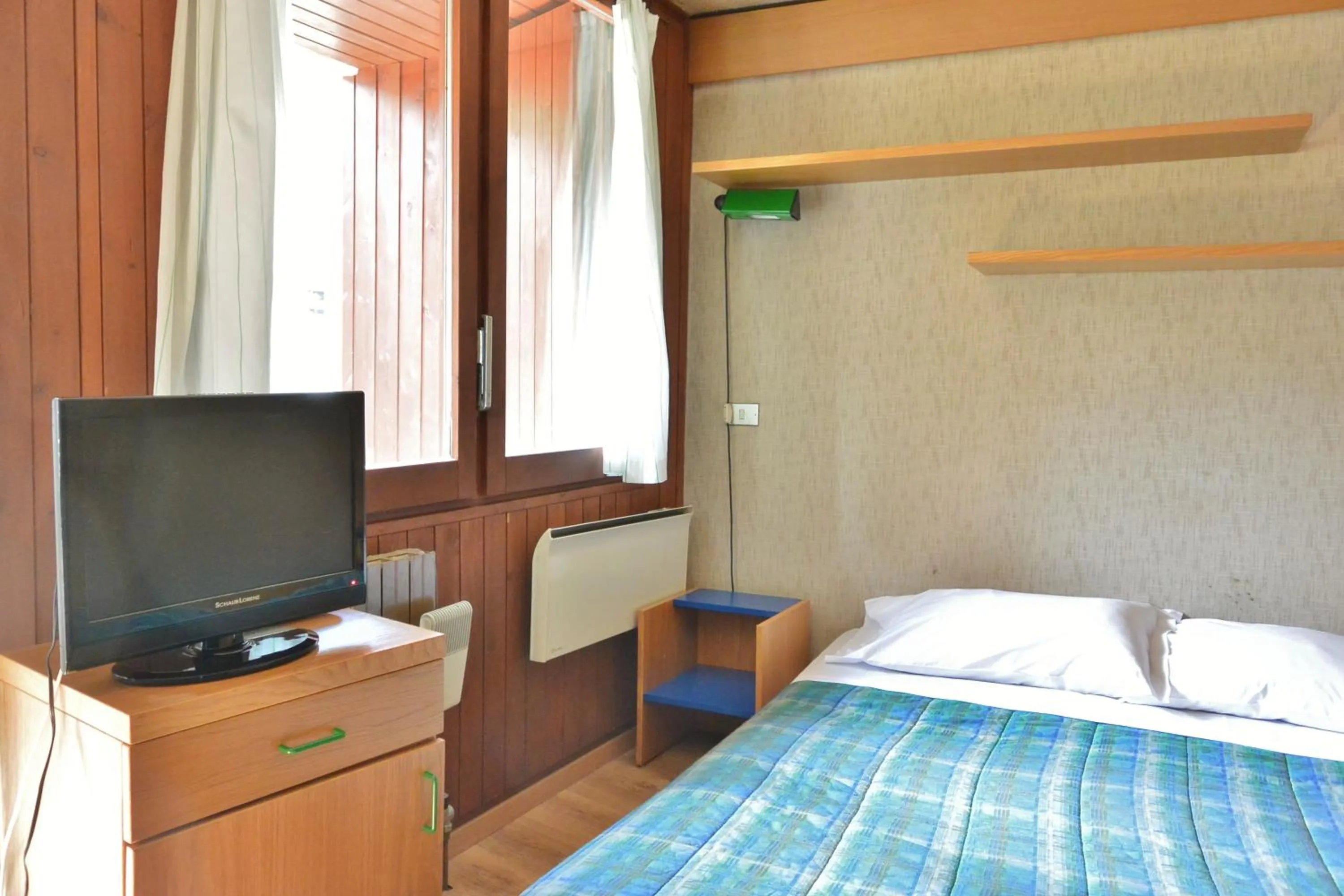 Bed in Appartamenti La Maison de Vacances