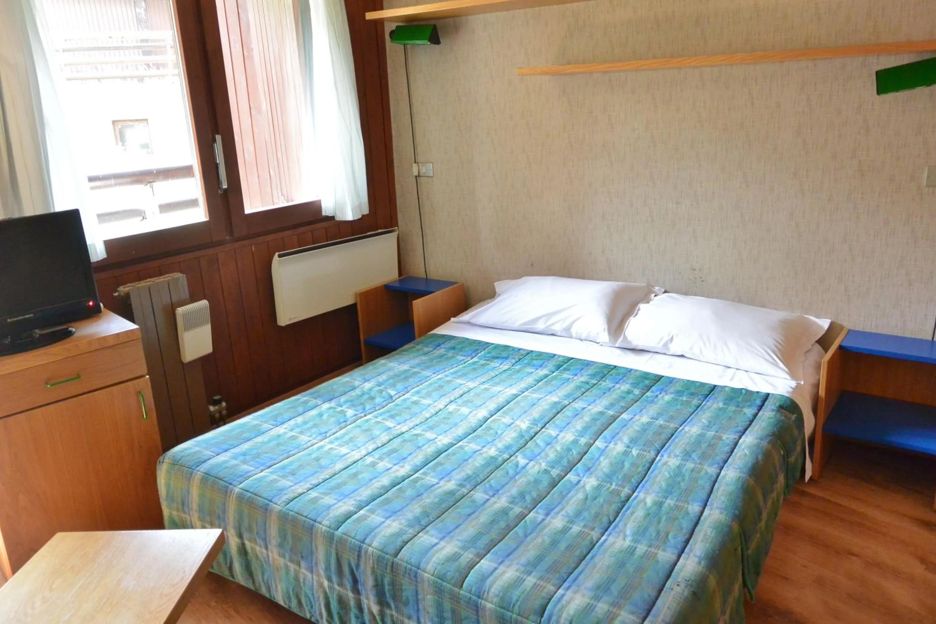 Bed in Appartamenti La Maison de Vacances