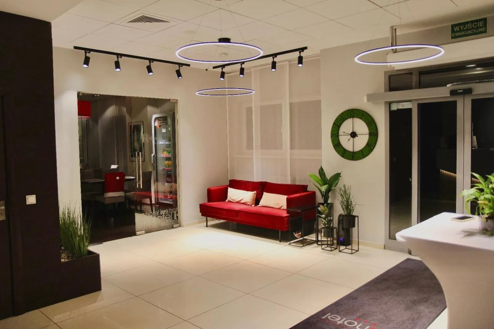 Seating area, Bed in Iness Hotel