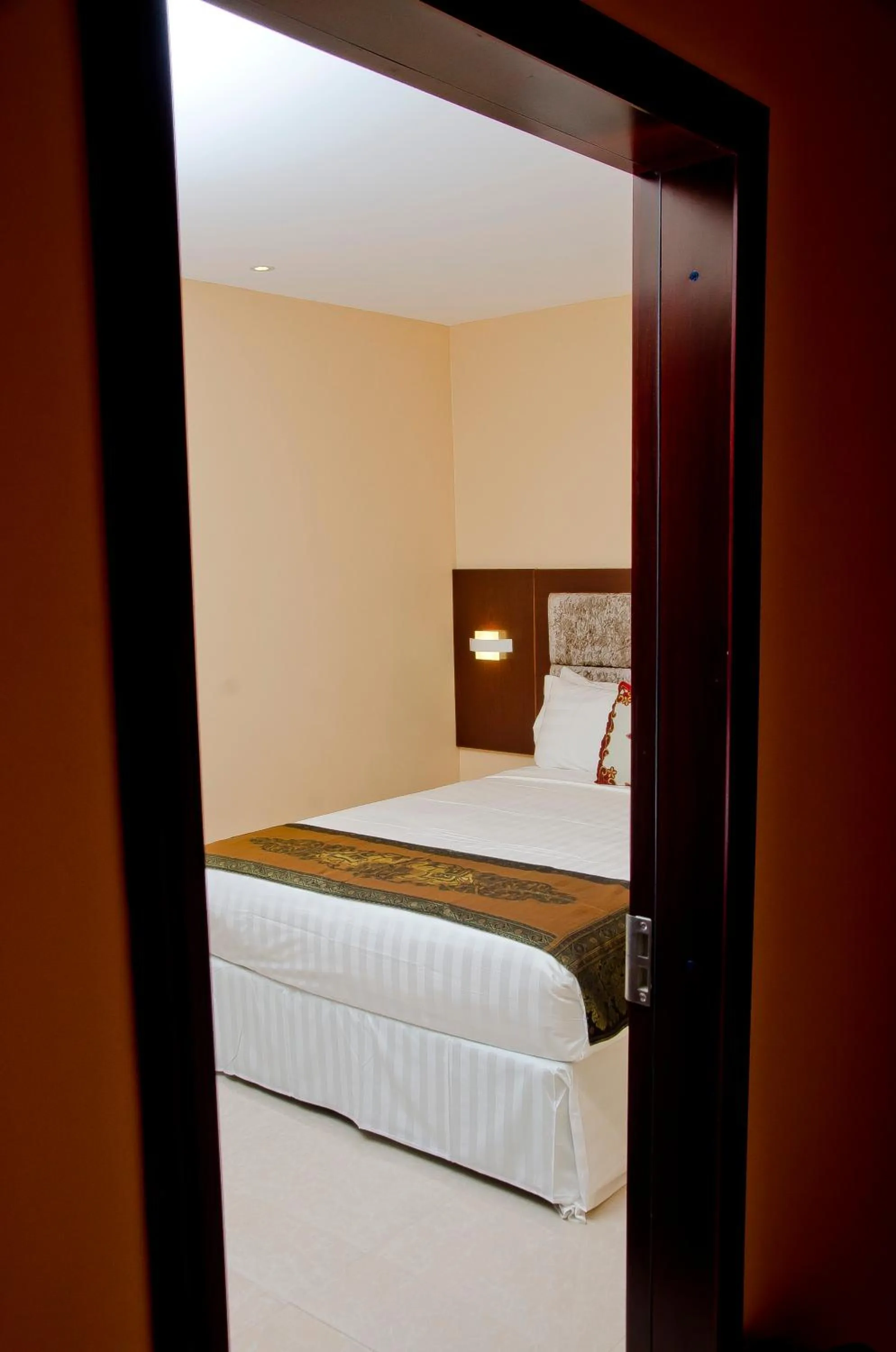 Bed in Grand Diamond Hotel Trinidad