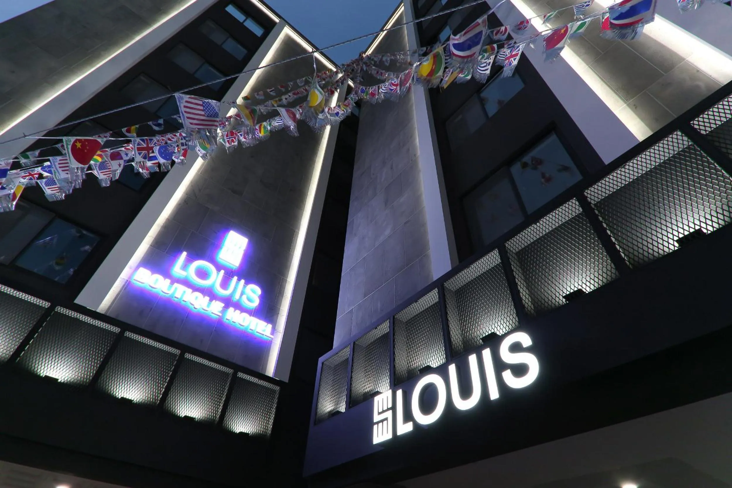 Property logo or sign in Louis Hotel