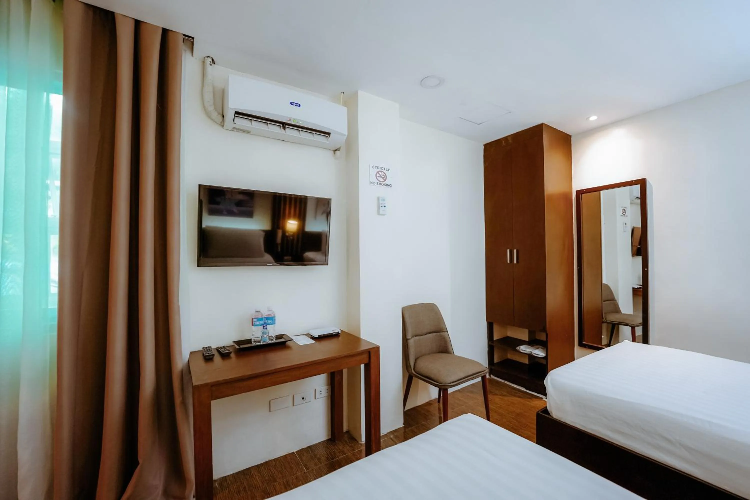air conditioner, Bed in Emerald Boutique Hotel