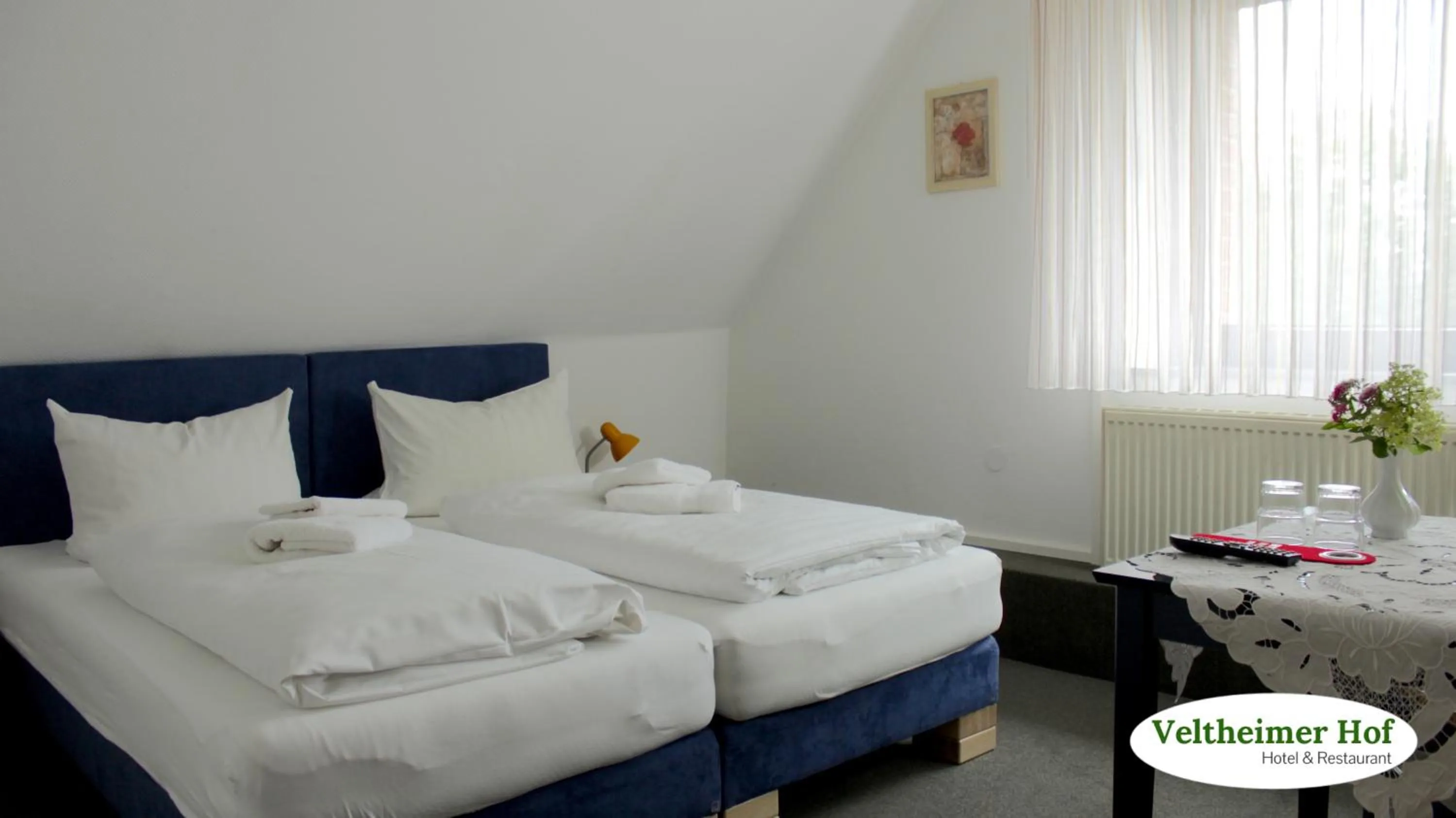 Photo of the whole room, Bed in Landgasthaus Veltheimer Hof