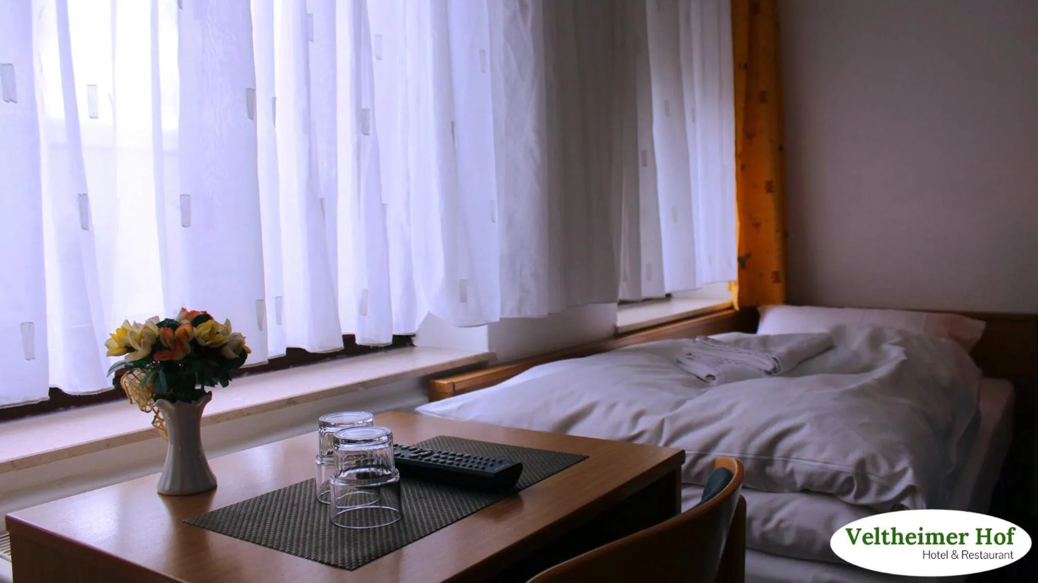 Photo of the whole room, Bed in Landgasthaus Veltheimer Hof