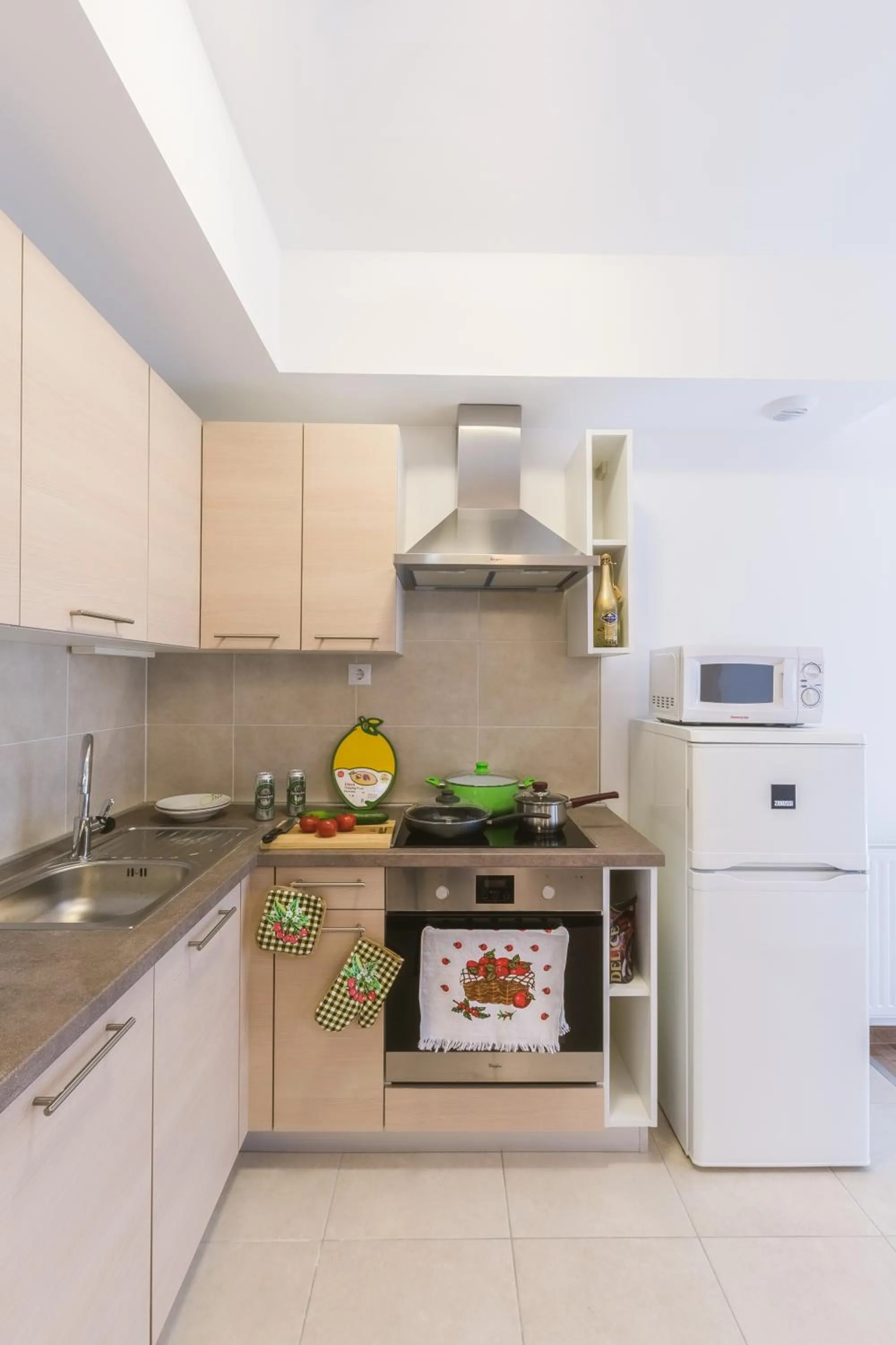 Kitchen or kitchenette in Corvin holiday Apartments hotel