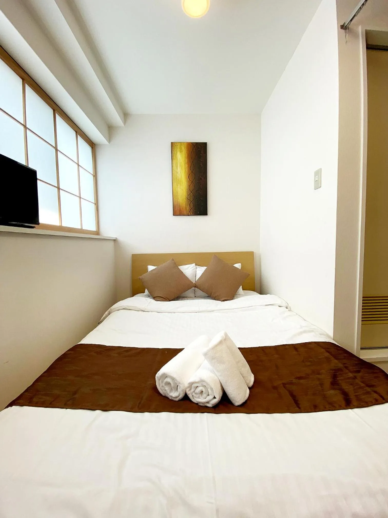 Bed in OUCHI HOTEL Yokogawa