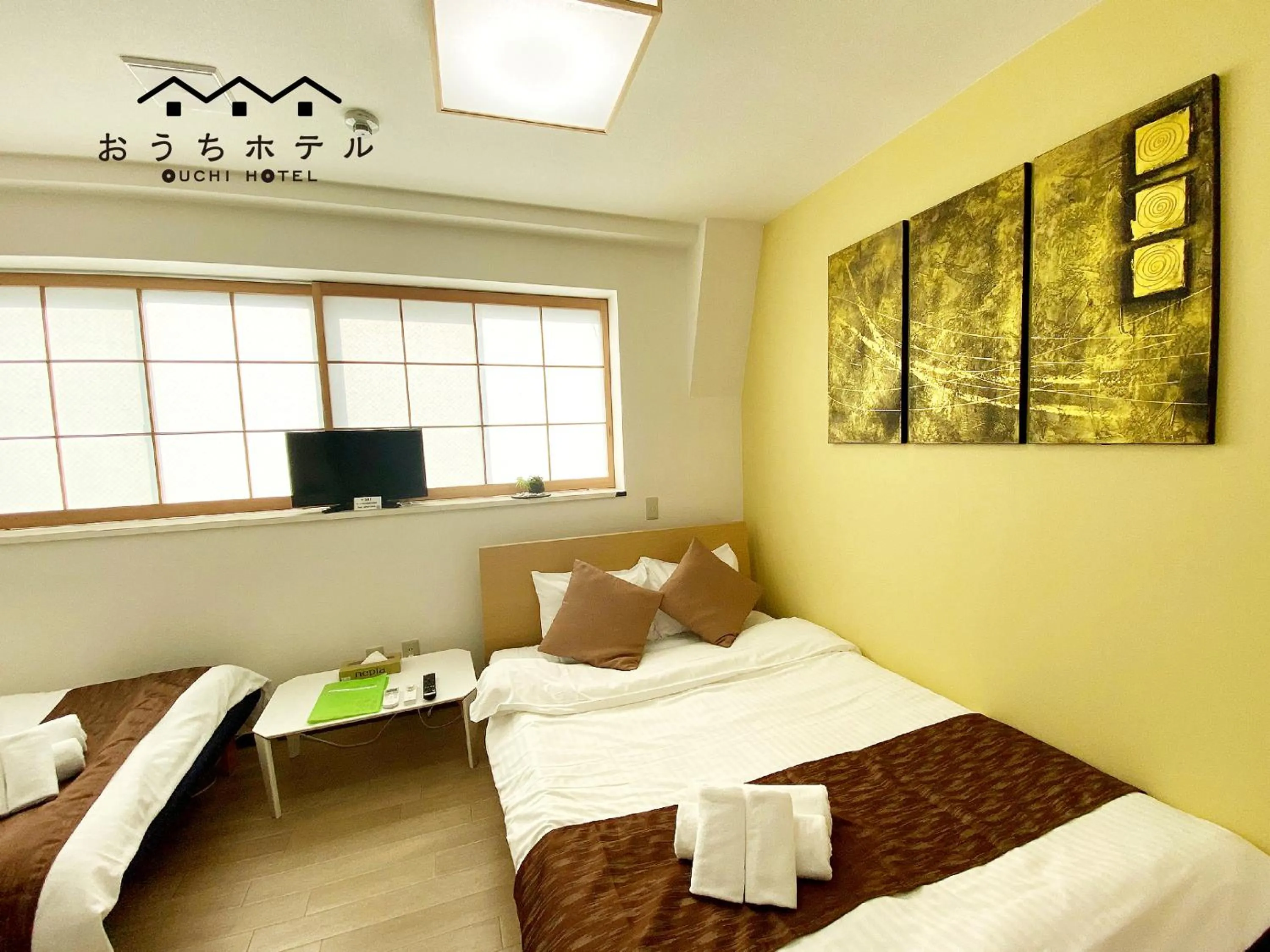 Bed in OUCHI HOTEL Yokogawa