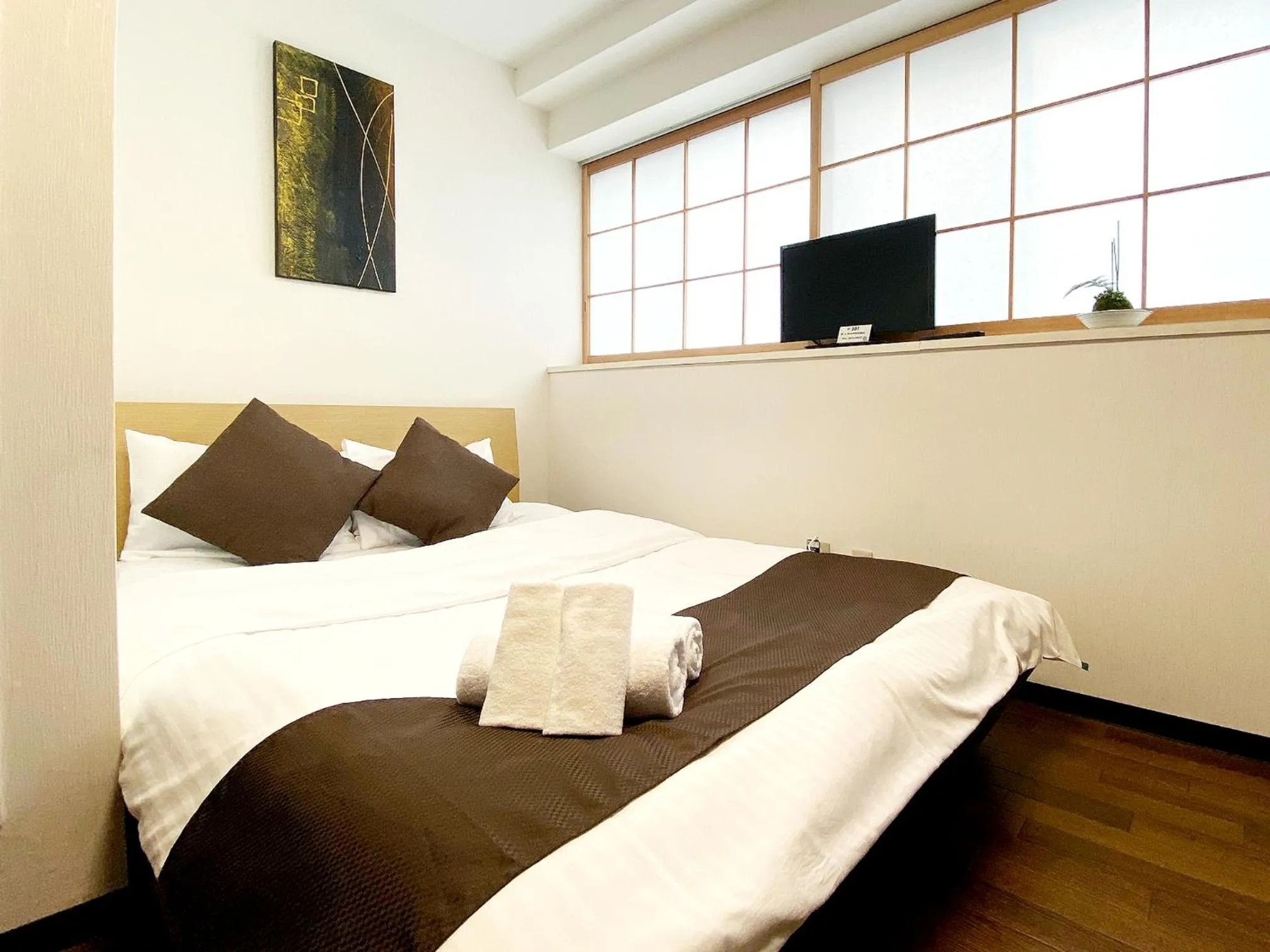 Bed in OUCHI HOTEL Yokogawa